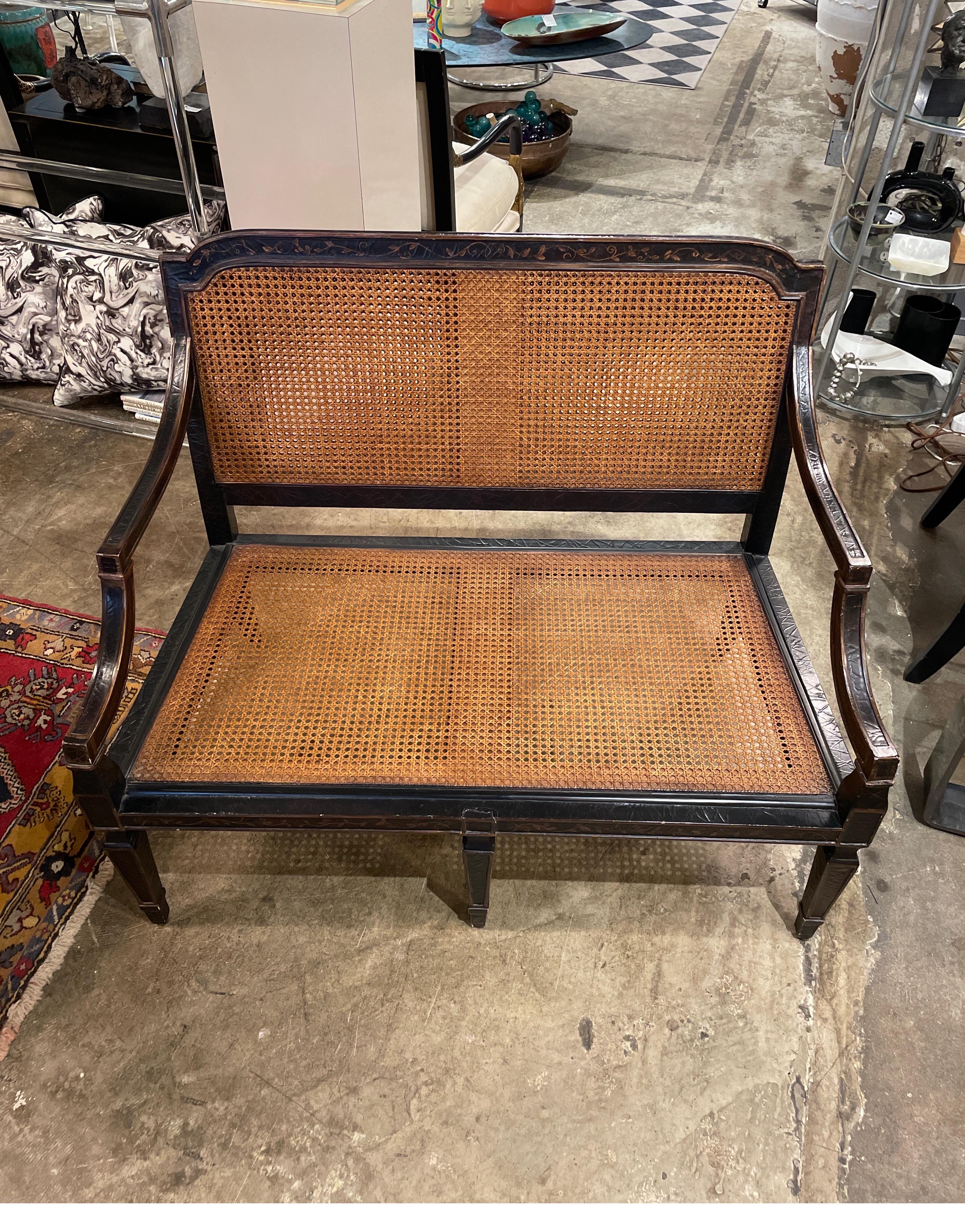 A Baker double caned chinoiserie style settee with cushion and pillow