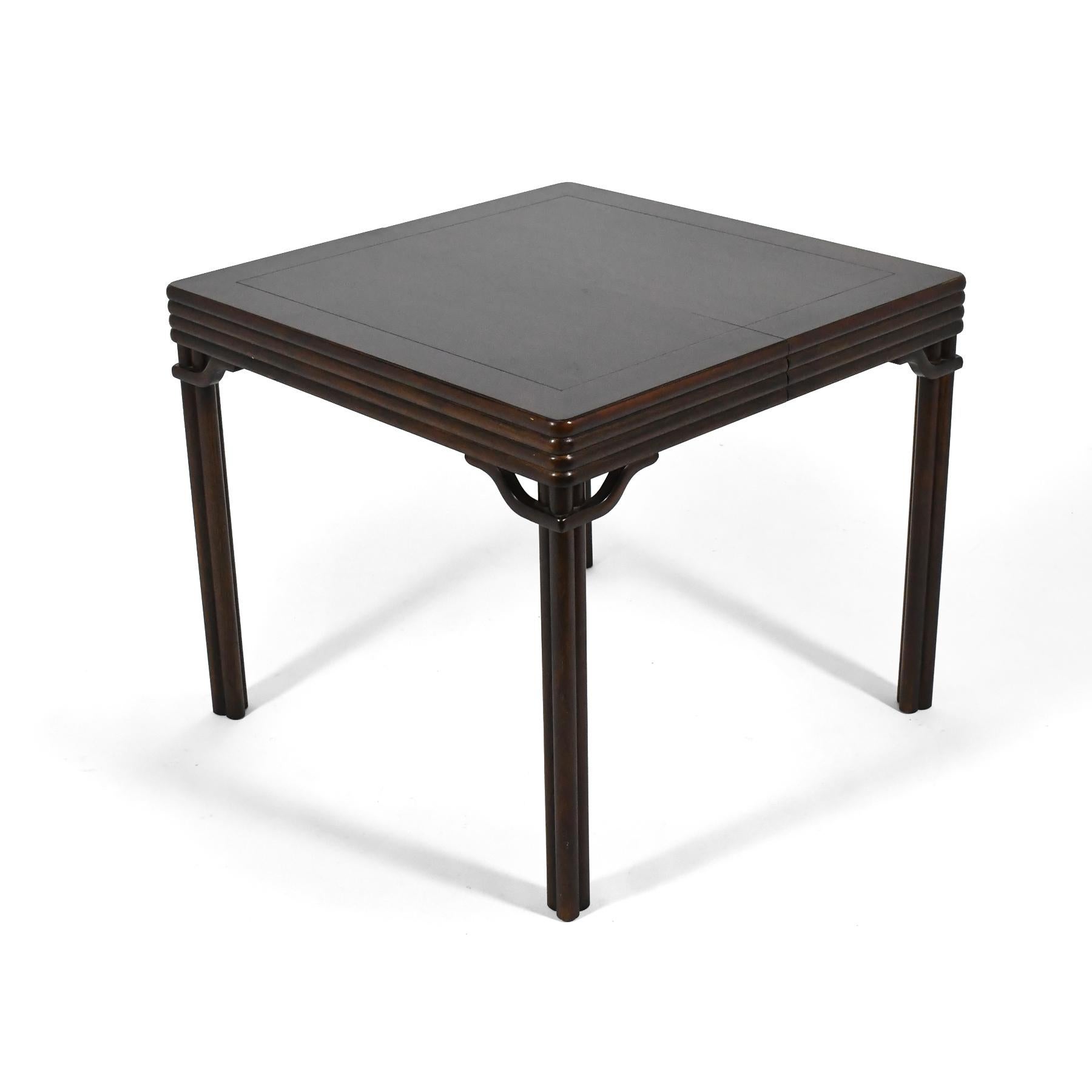 This beautiful mahogany game table by Baker has elegant detailing and two folding 13