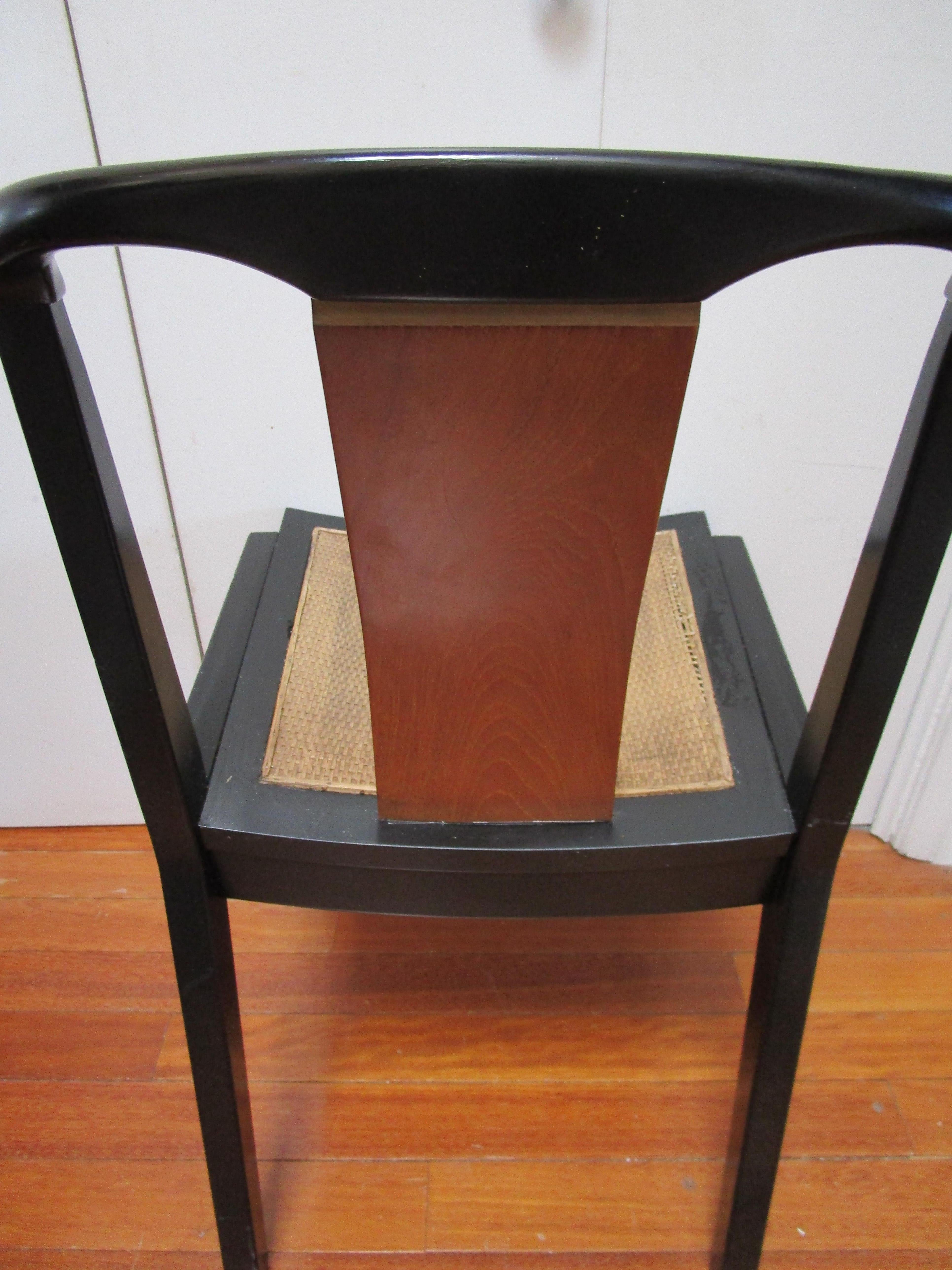 Highly collectible, this is a piece from the Baker Far East Collection of the 1950s. It is unique. The chair was designed as part of a two-piece set with a desk. It has all of the graceful design style of Michael Taylor with the distinctive walnut