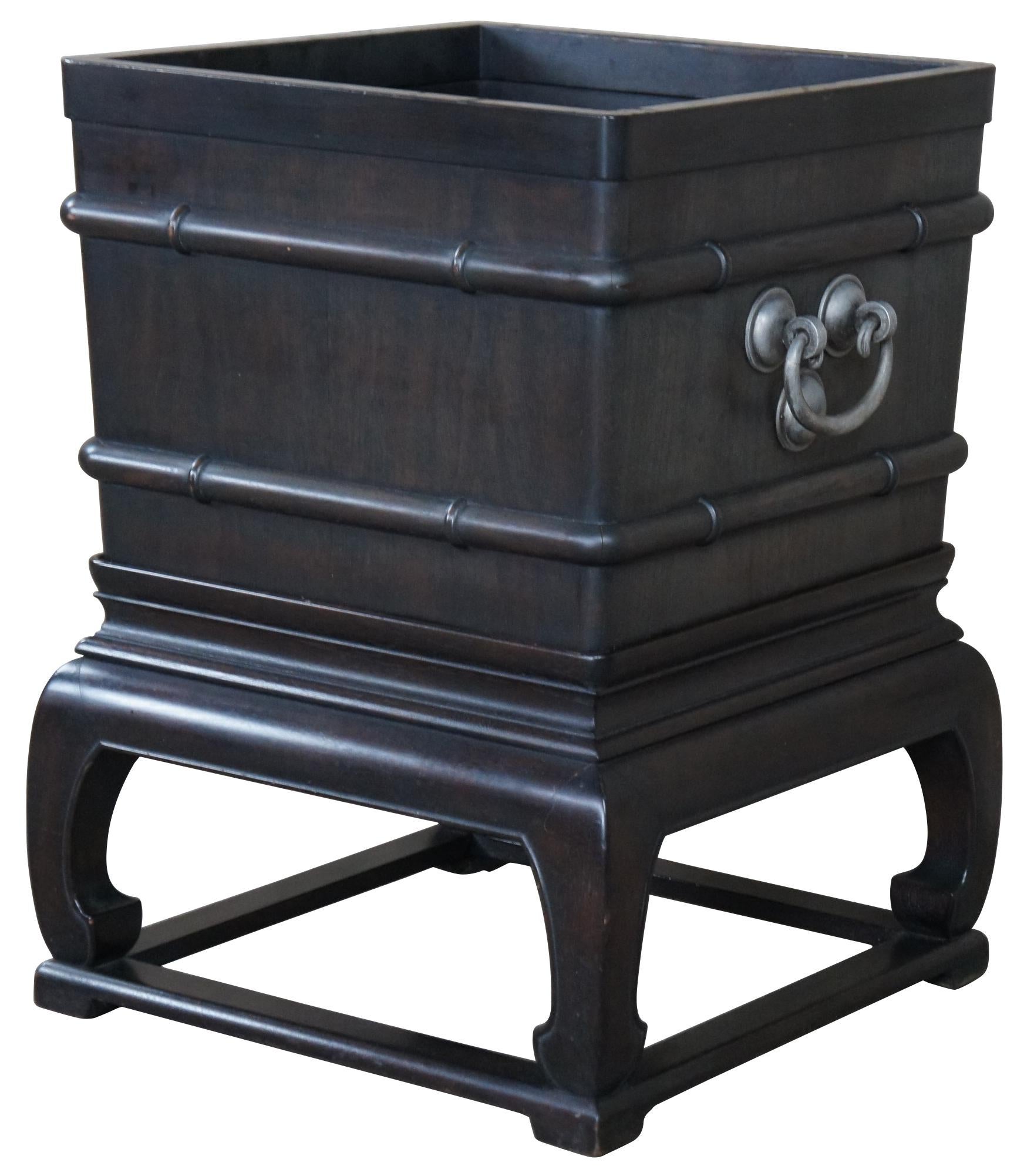 A rare and extraordinary Baker Furnituer Far East Collection planter on stand. Made from dark walnut with bamboo form trim and elegant silver drop pulls. 

After World War II, Hollis Baker visited East Asia, and returned to Grand Rapids inspired