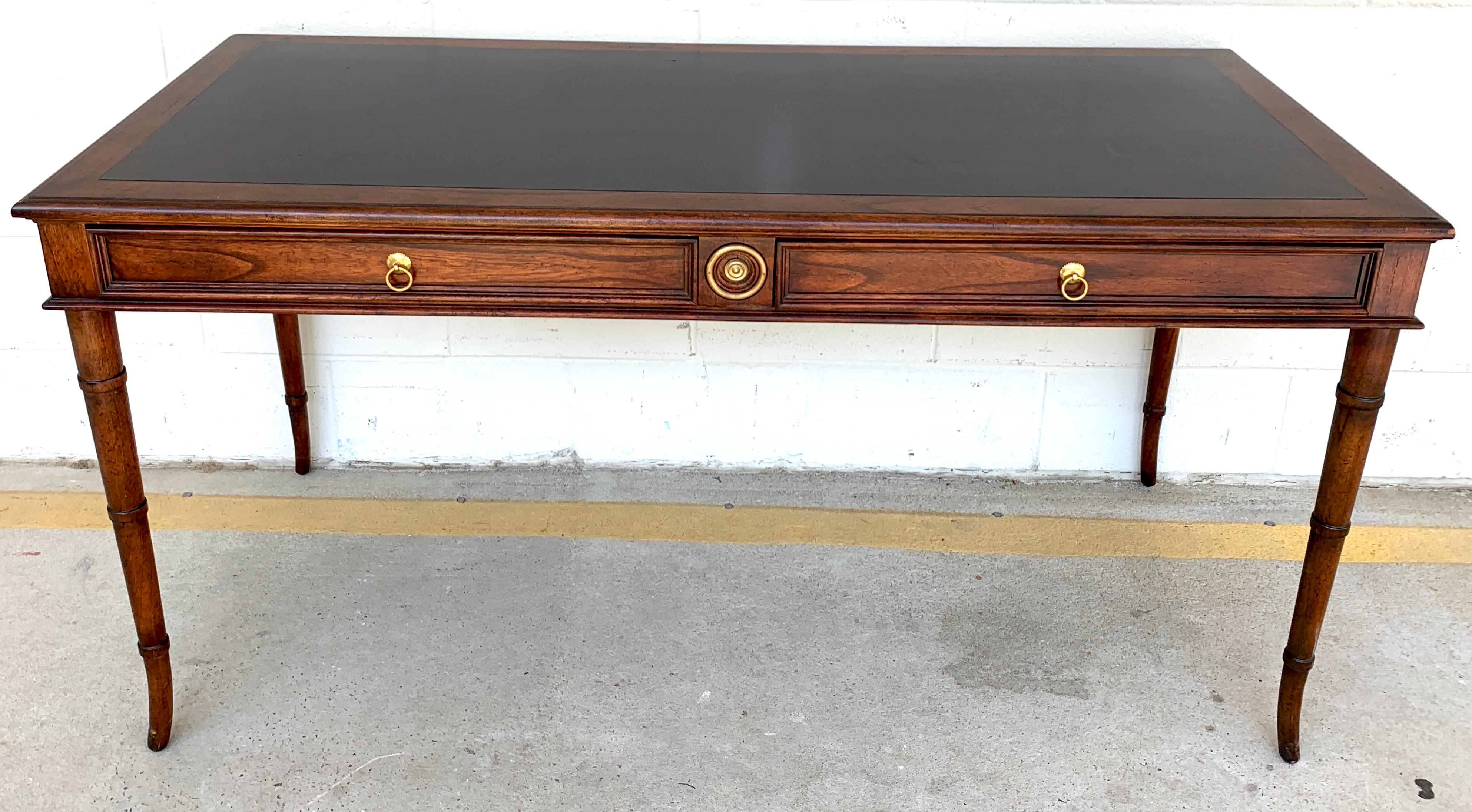 Baker faux bamboo mahogany and leather desk, fitted with two 25