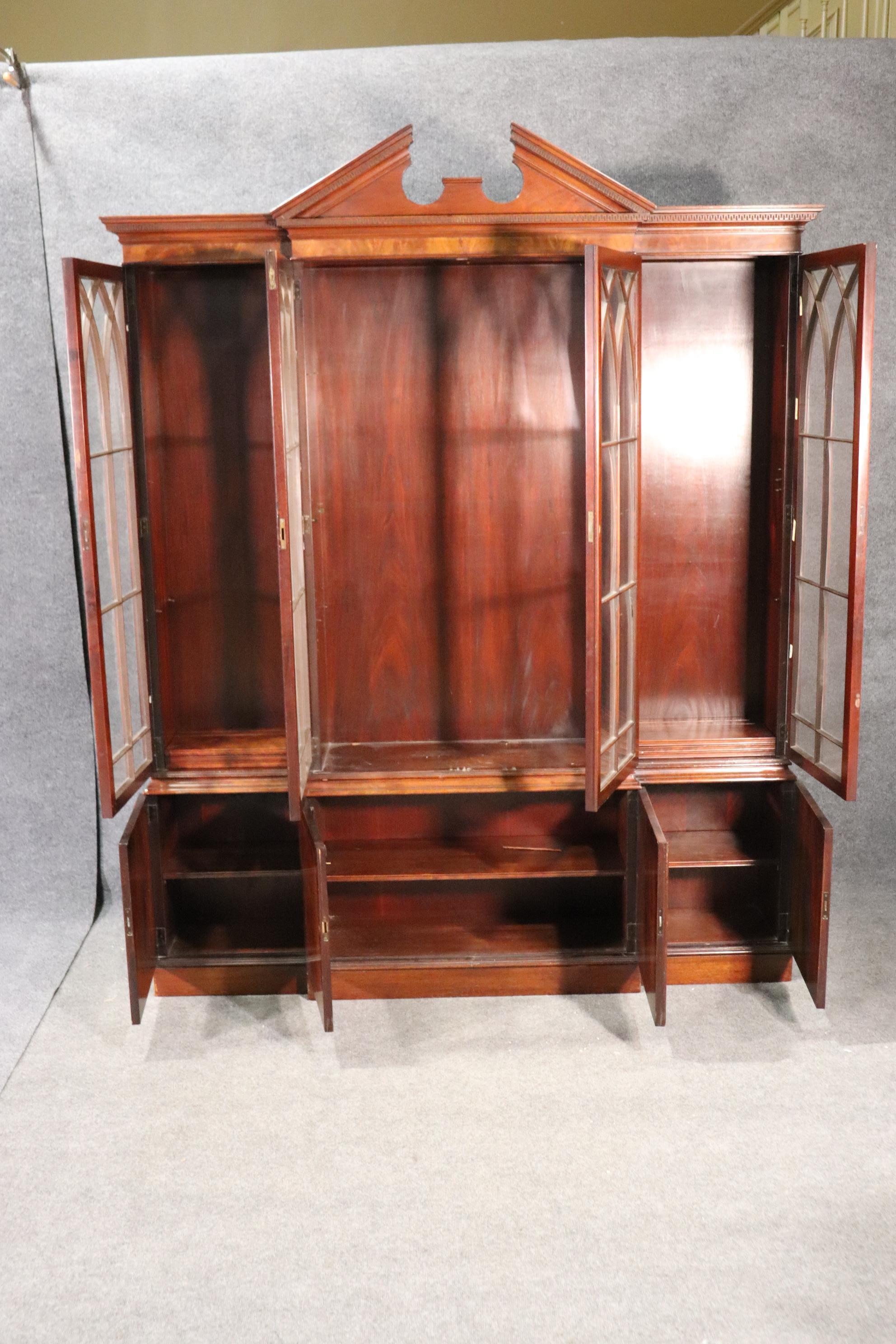 This is a beautiful Baker mahogany breakfront. This two piece breakfront measures 87 tall x 69 wide x 13 inches deep so it can be used in many places that deeper breakfronts can't be used in.

We will make 4 shelves for this piece as agreed for the