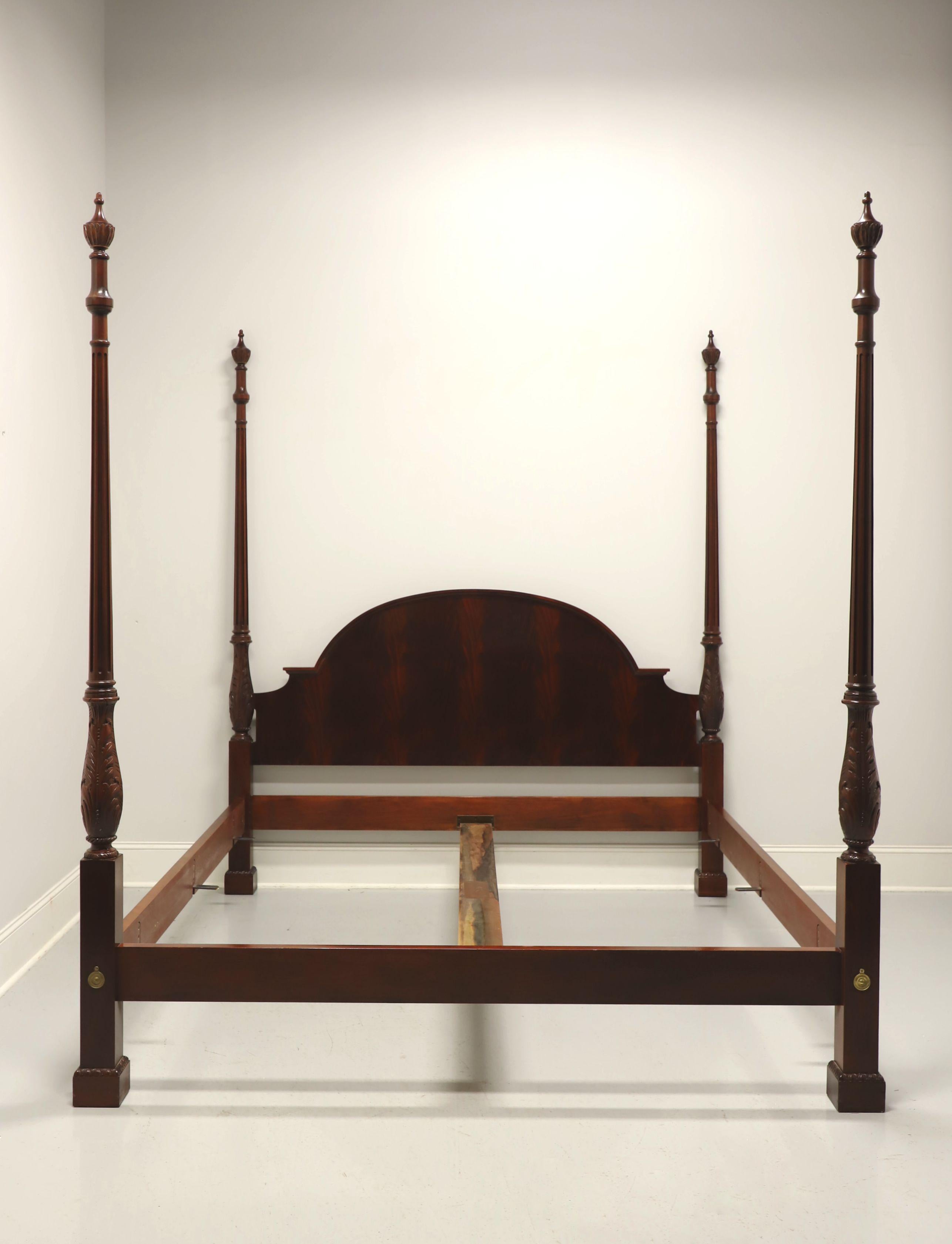 A Georgian style California king size poster bed by Baker Furniture. Flame mahogany with arched headboard, four carved posts with decorative finials, brass hardware, bolt held side rails with wood bracers, center wood rail attaches to metal supports