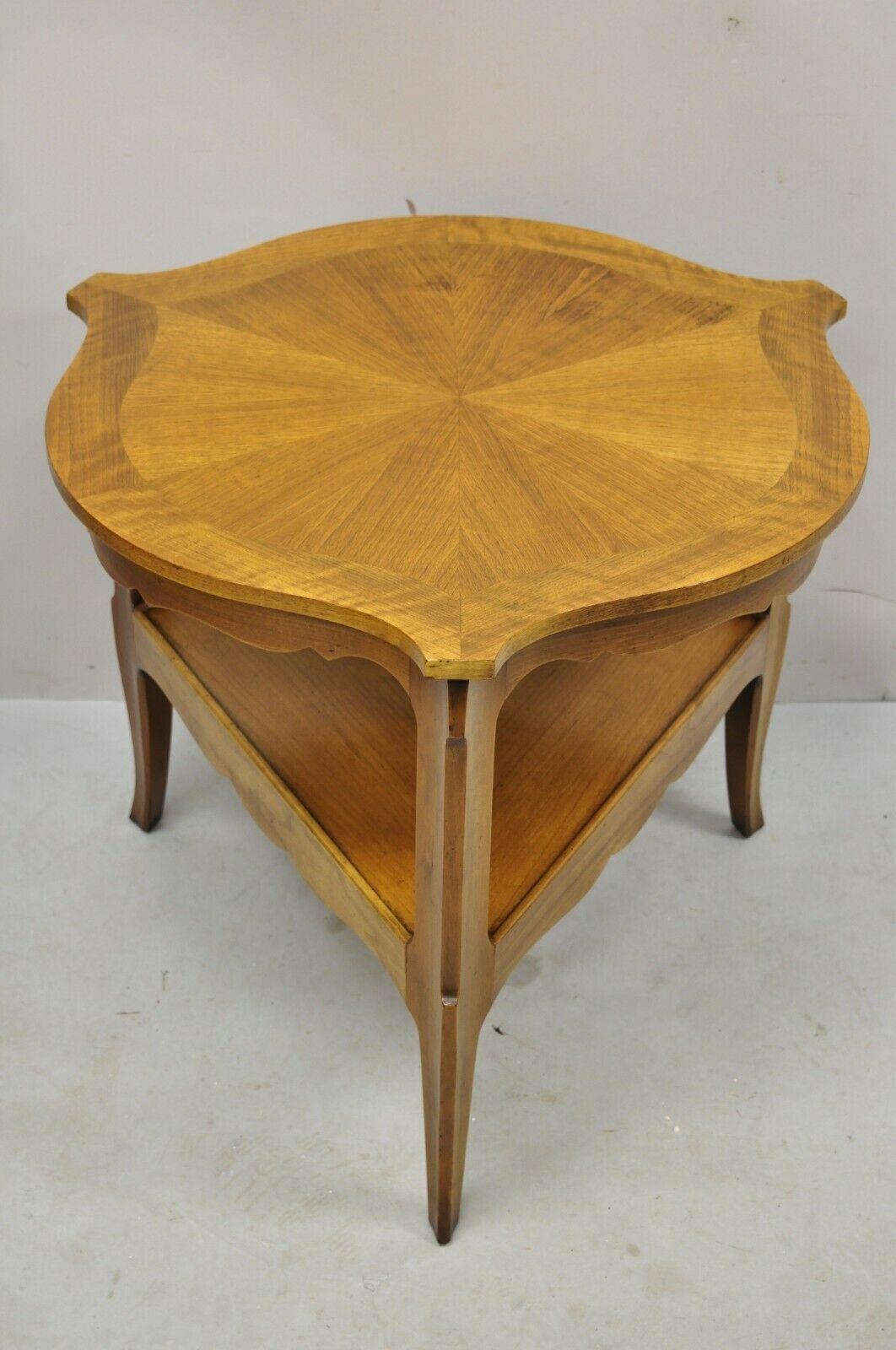 Baker French Country Provincial Walnut Sunburst inlay triangular accent side table. Item features sunburst inlaid top, lower shelf, triangular shape, tripod base, beautiful wood grain, original label, very nice vintage item, quality American