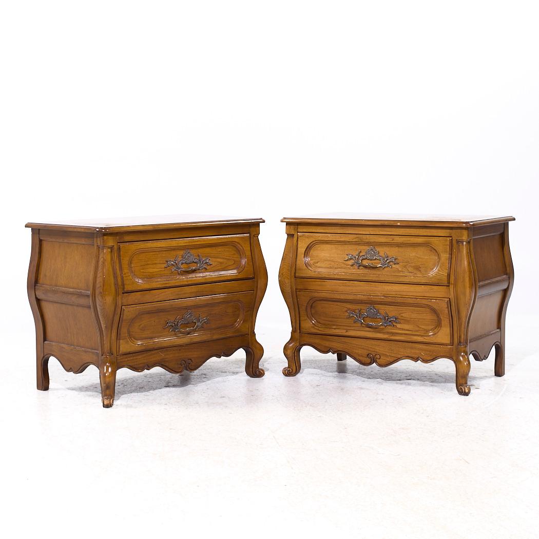 Baker French Louis XV Style Oak and Burlwood Bombe Chest Nightstands - Pair

Each nightstand measures: 32 wide x 19 deep x 25 inches high

We take our photos in a controlled lighting studio to show as much detail as possible. We do not Photoshop out