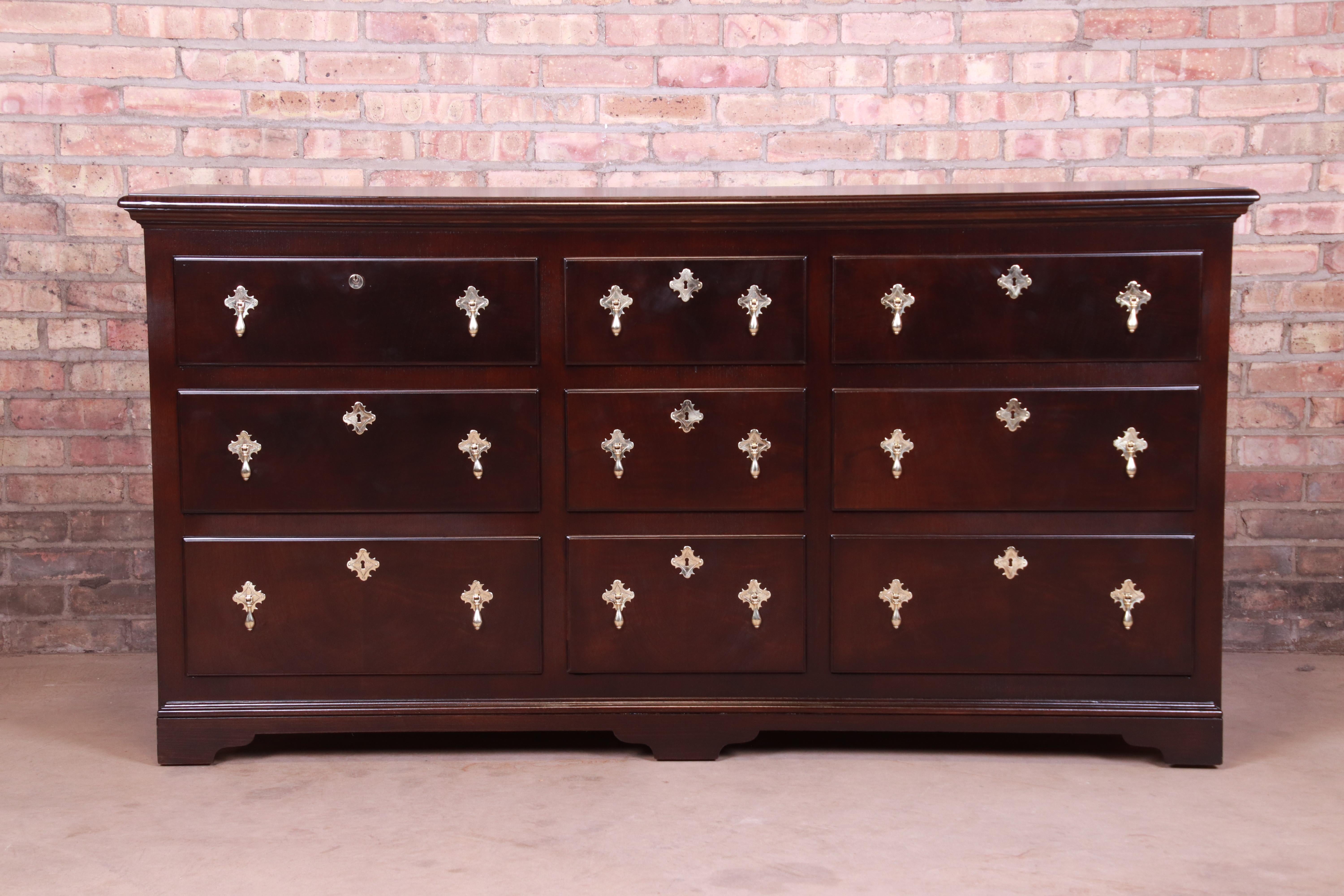 A gorgeous 18th century Flemish reproduction chest of drawers, dresser, or buffet server

By Baker Furniture

USA, mid-20th century

Mahogany, with original brass hardware.

Measures: 66