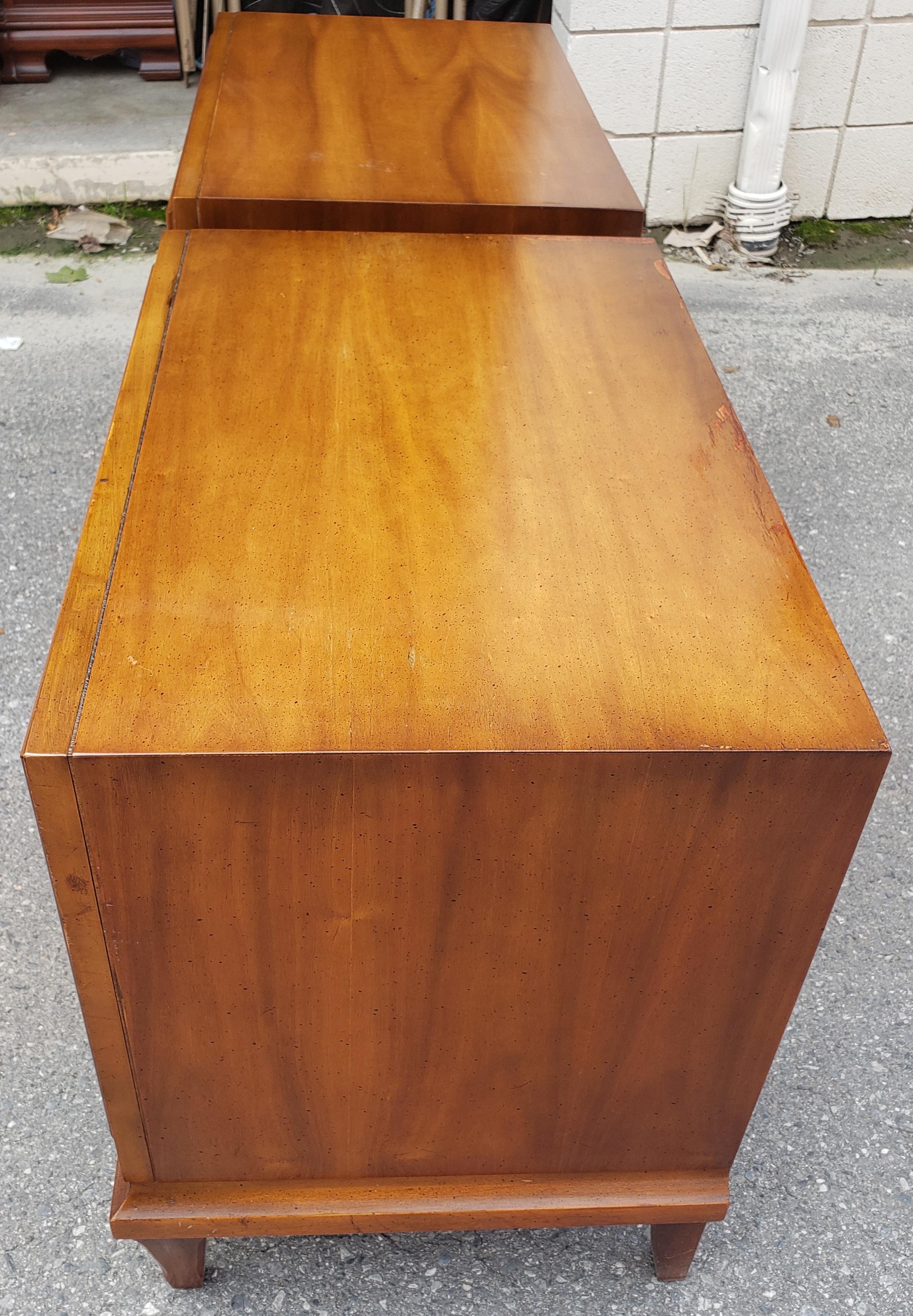 For you consideration is a pair of Mid-Century Modern walnut nightstands side tables attributed to Baker Furniture.
Very good vintage condition with minor loss. Plenty of storage in two large drawers. Original hardware. Measurements are 26.14