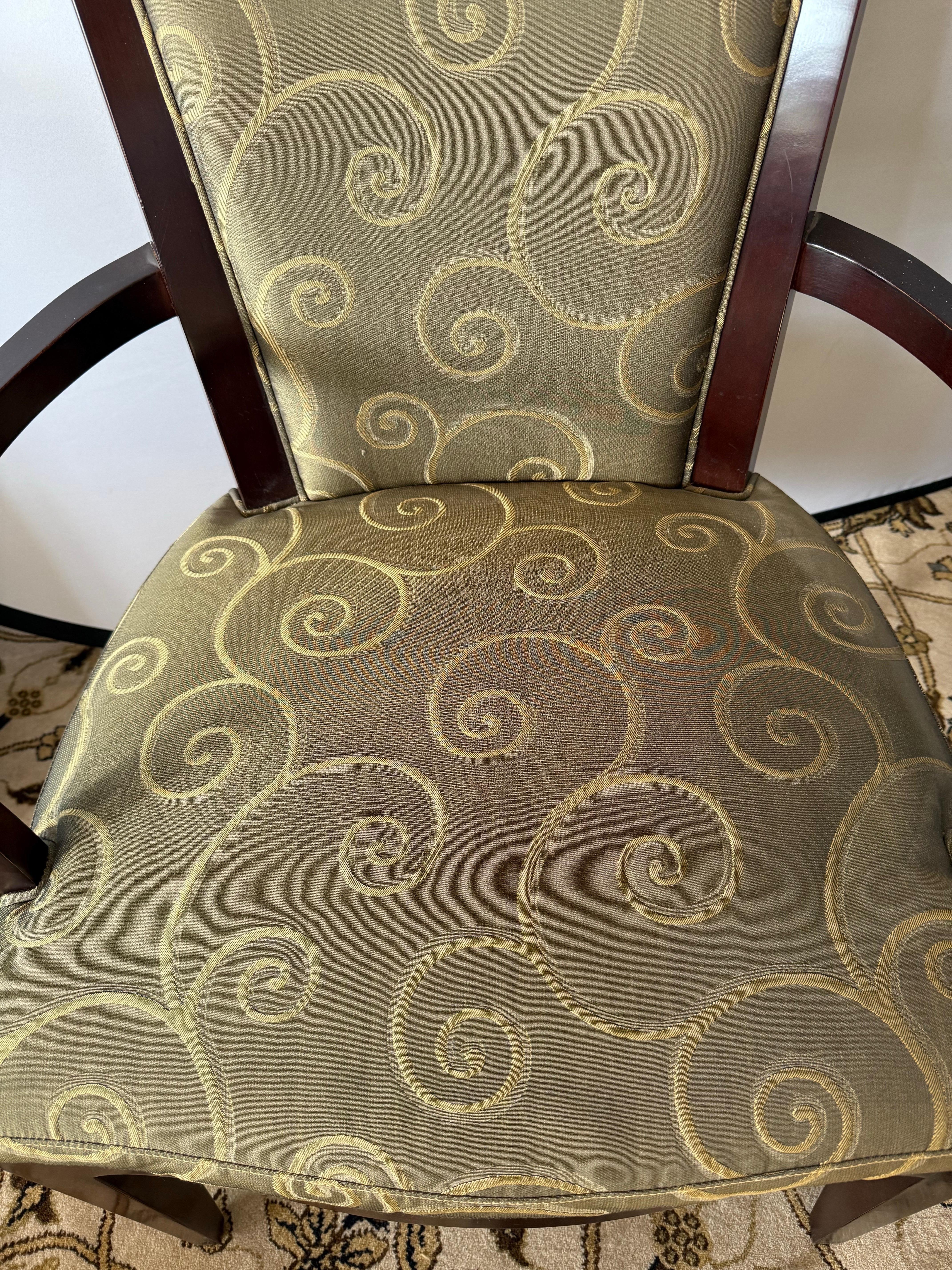 Iconic set of Barbara Barry for Baker Furniture designed dining room chairs.
There are eight in all and six are side chairs and two are arm chairs.  The fabric was custom and is original and there is some slight staining on fabric as shown.  However