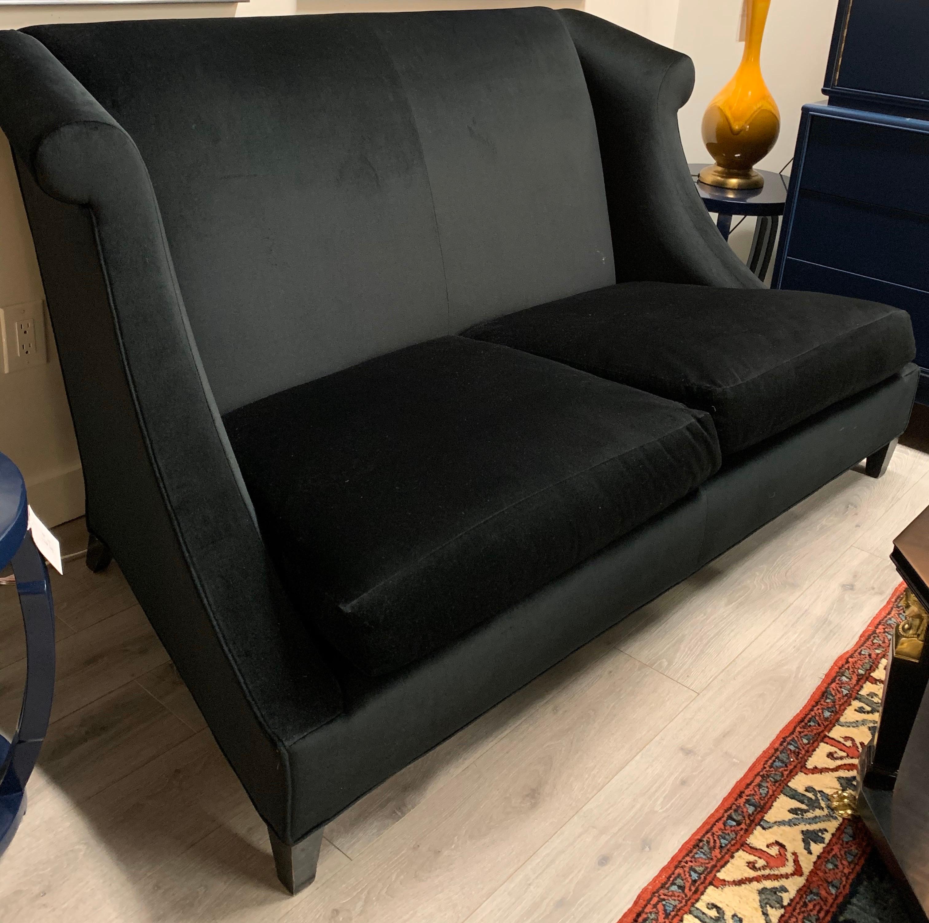 Elegant signed Baker Furniture sculptural loveseat by Baker Furniture. What sets it apart is the magnificent black mohair fabric. It features eight way hand tied construction and has lines to die for. Enjoy all the pictures. Perfect scale for