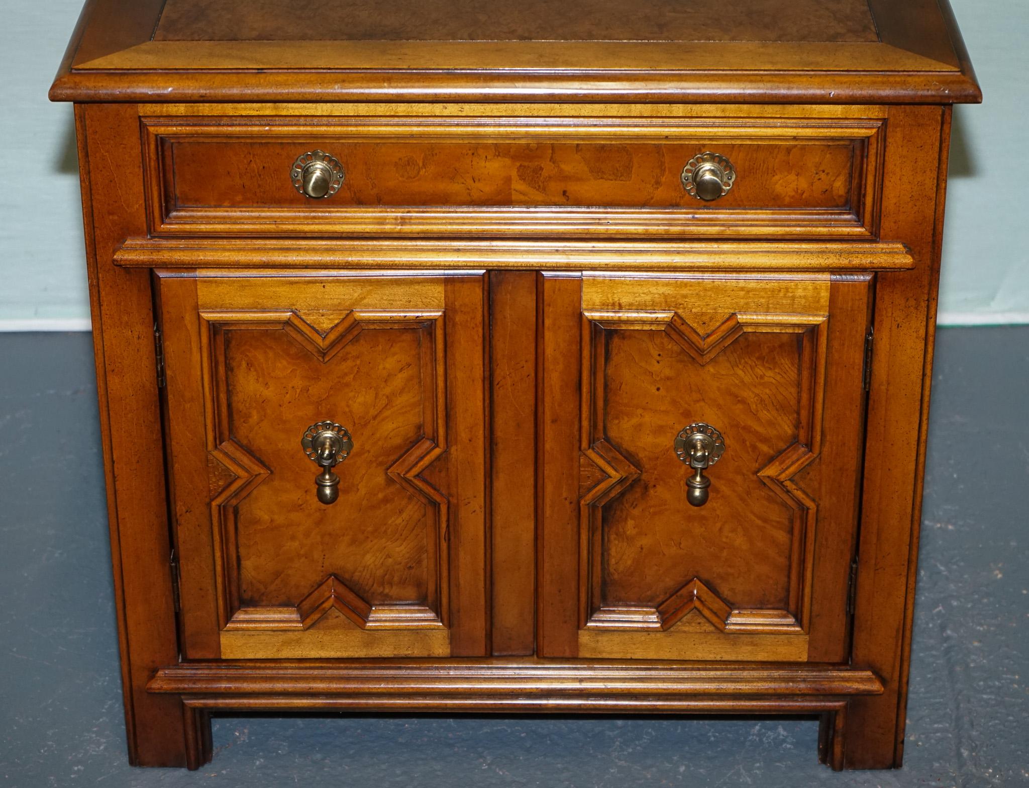 Hand-Crafted BAKER FURNITURE BURR WALNUT BEDSIDE CABiNET WITH DRAWER AND CARVED DOORS For Sale