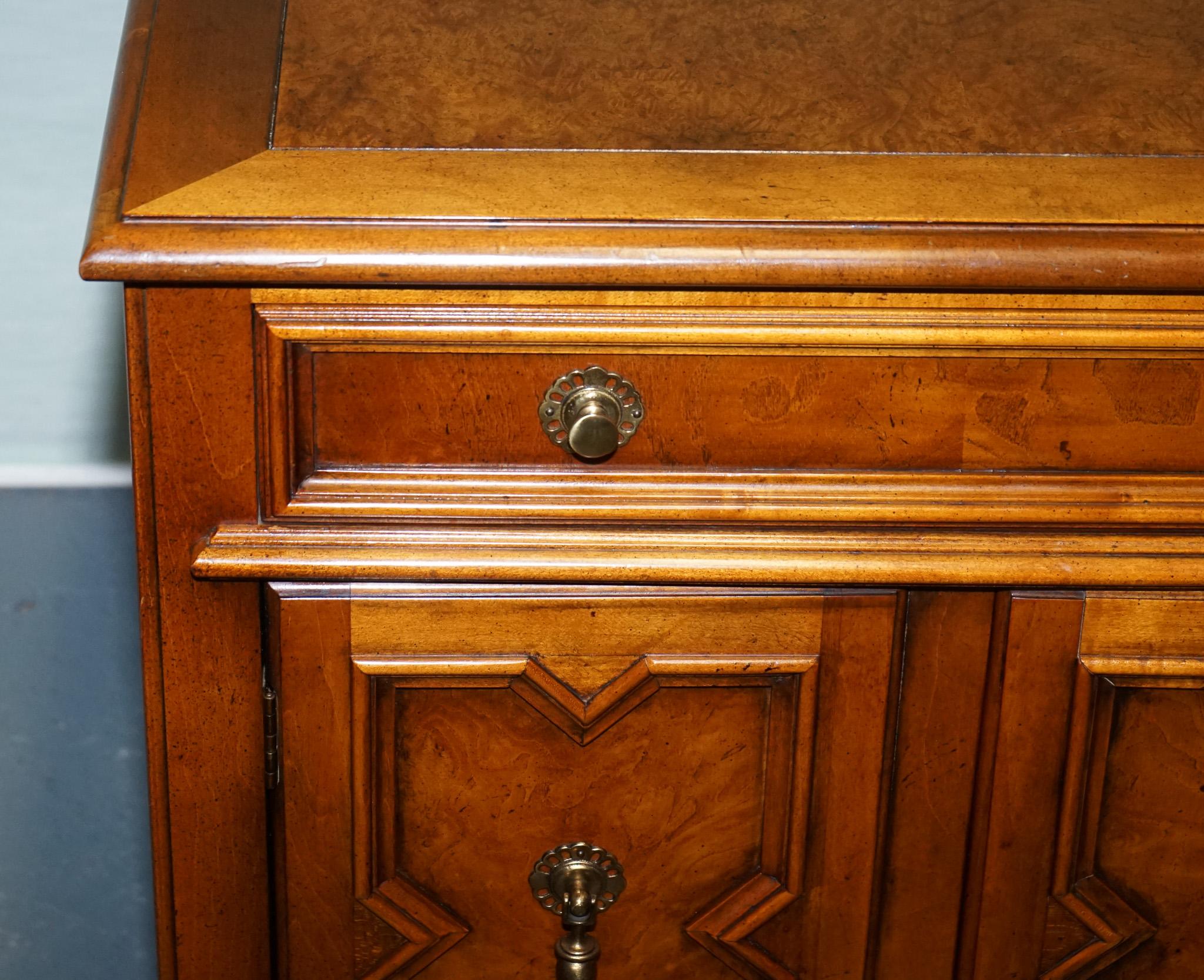 20th Century BAKER FURNITURE BURR WALNUT BEDSIDE CABiNET WITH DRAWER AND CARVED DOORS For Sale