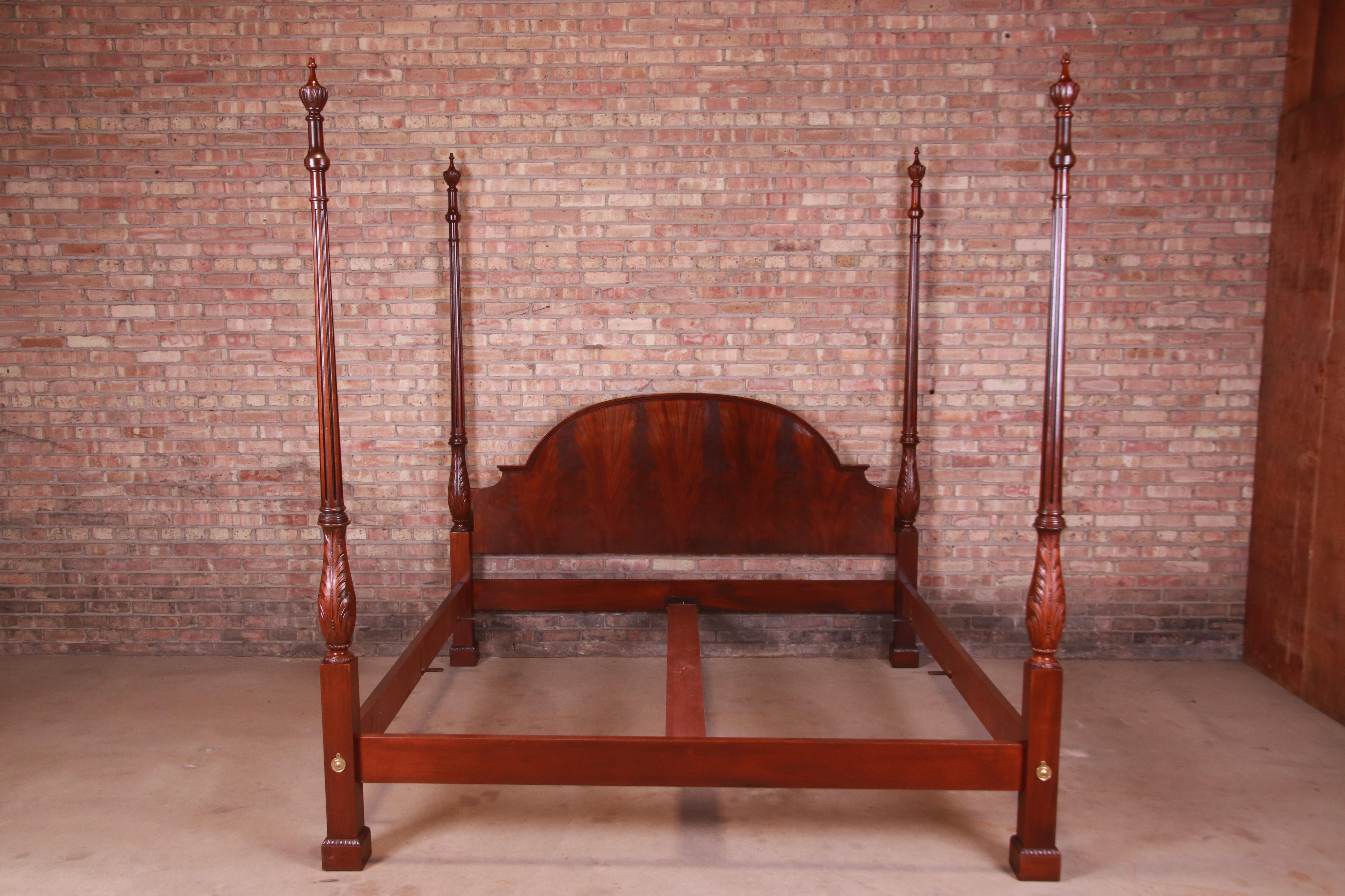 A gorgeous Chippendale style four poster king size bed

By Baker Furniture

USA, Circa 1980s

Book-matched flame mahogany headboard, with carved solid mahogany posts and brass accents.

Measures: 84