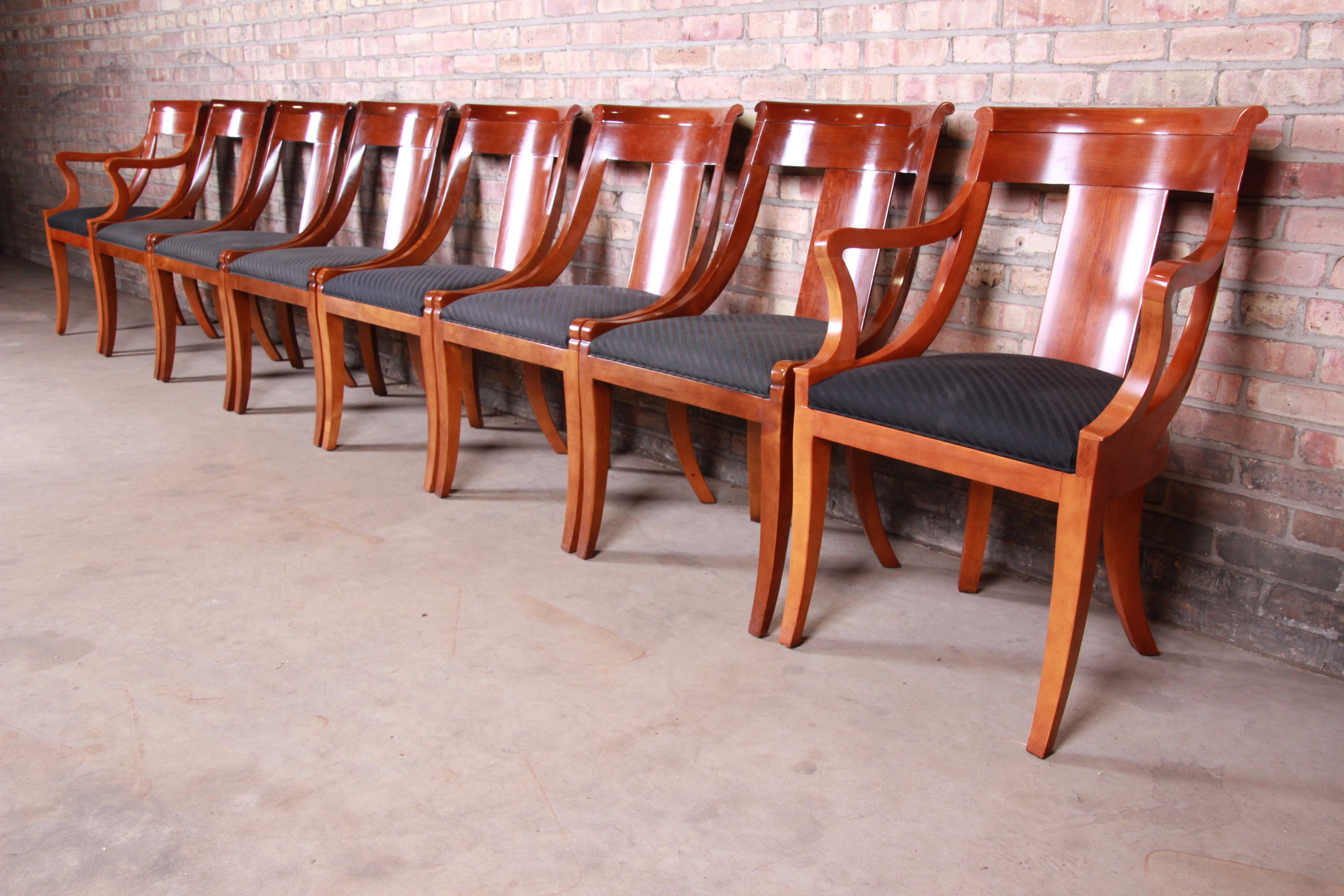 A gorgeous set of eight Regency style dining chairs

By Baker Furniture

USA, circa 1980s

Solid cherrywood, with upholstered seats.

Measures:
Armchairs - 23.5