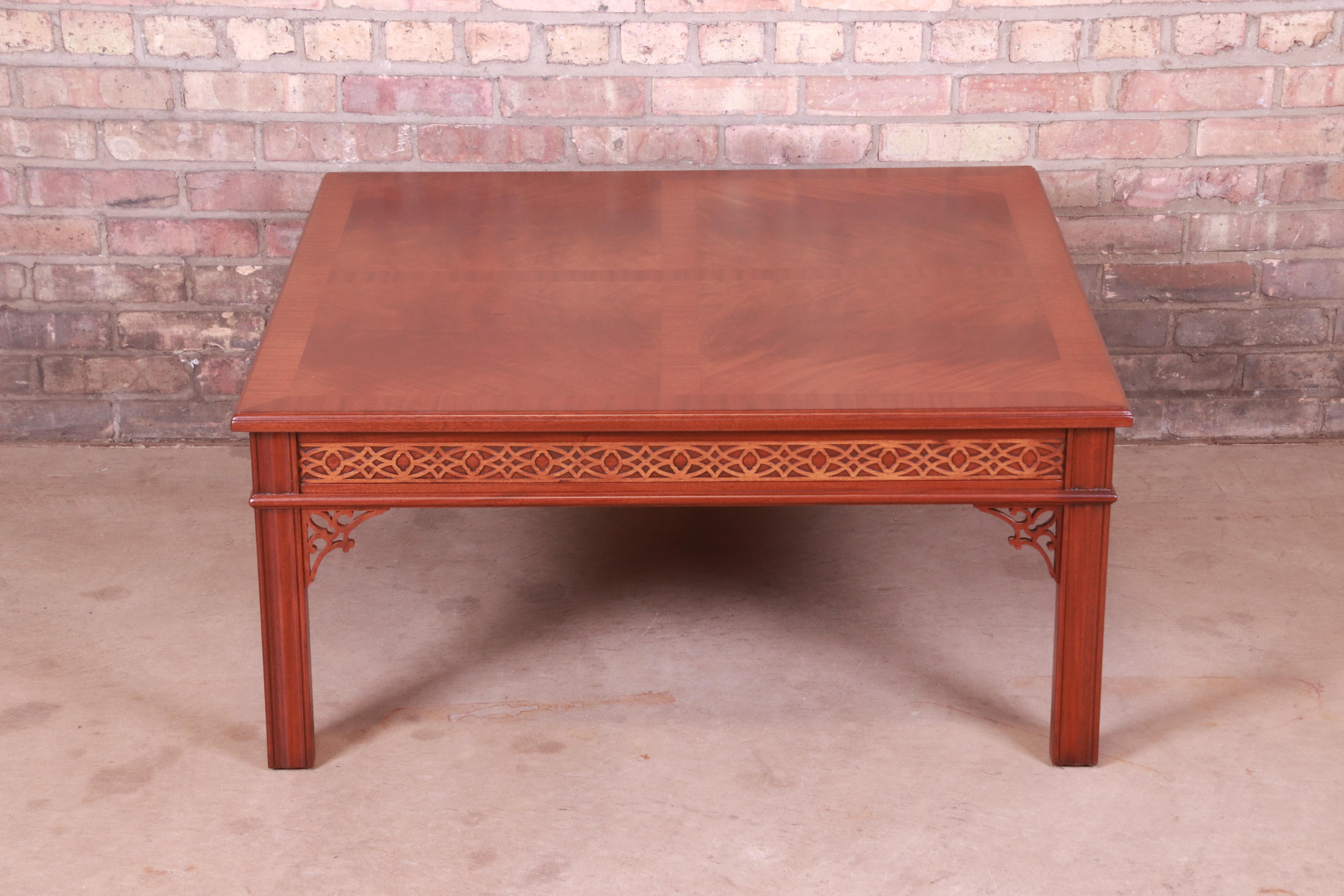 An exceptional Chinese Chippendale style coffee or cocktail table

By Baker Furniture

USA, Circa 1980s

Book-matched mahogany, with ornate carved details.

Measures: 38