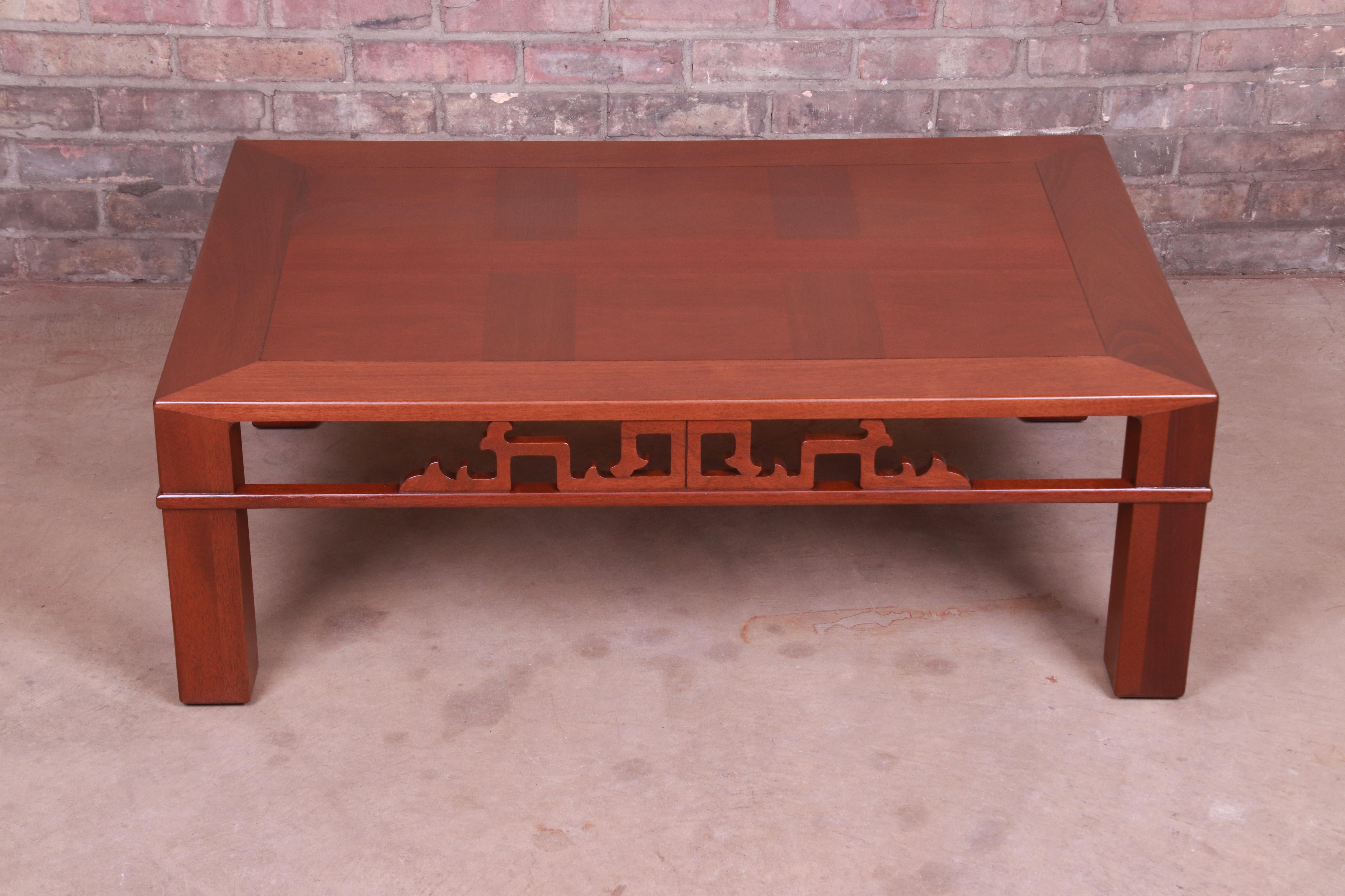 An exceptional Mid-Century Modern Hollywood Regency chinoiserie carved mahogany coffee or cocktail table

By Baker Furniture,

USA, circa 1940s

Measures: 39.63