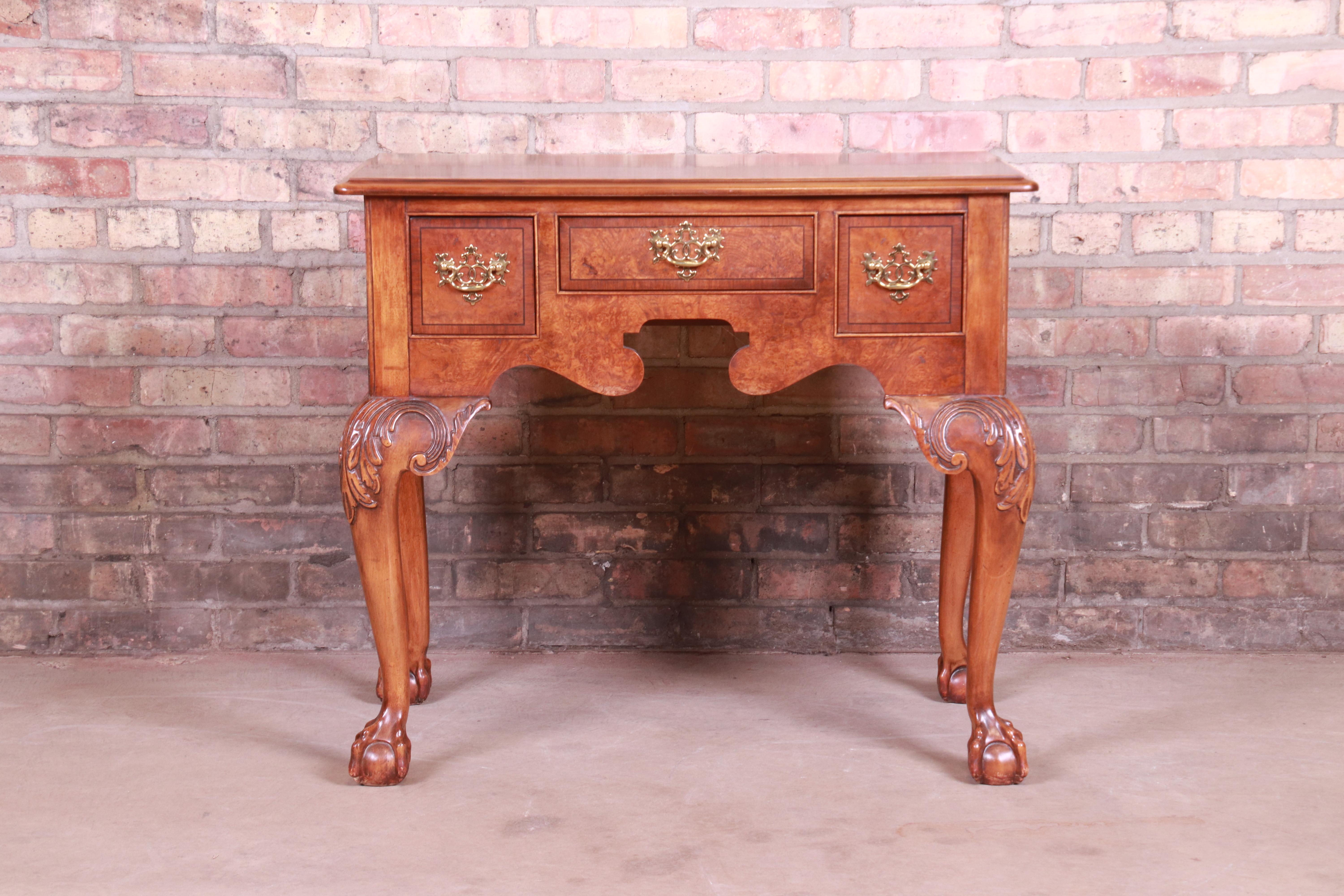 A gorgeous Chippendale style lowboy dresser, sideboard buffet, or server

By Baker Furniture

USA, circa 1980s

Burled walnut, with carved solid walnut legs and original brass hardware.

Measures: 32