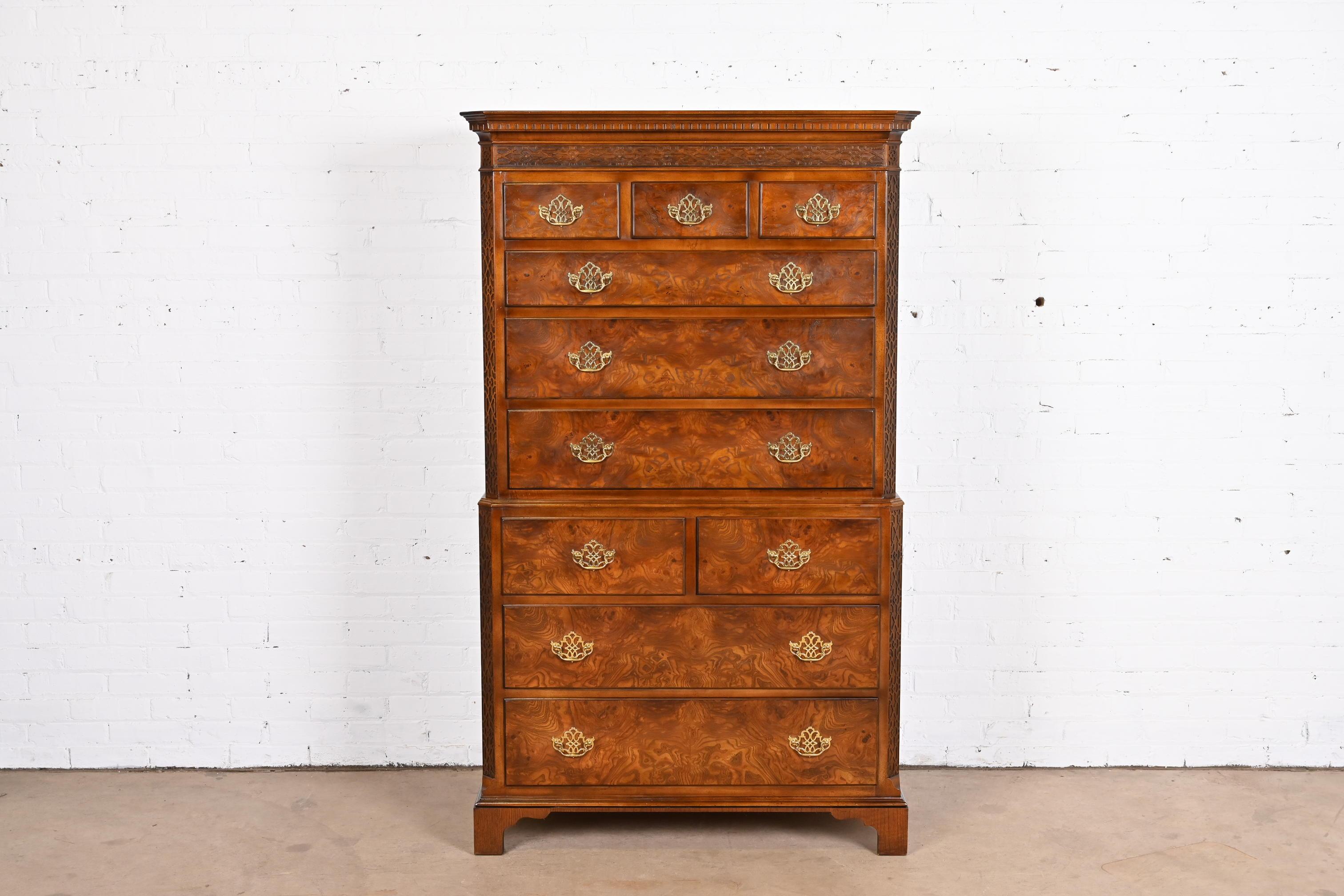 A gorgeous Chippendale style ten-drawer highboy dresser or chest of drawers

By Baker Furniture

USA, Circa 1980s

Carved walnut, with burled walnut drawer fronts and original brass hardware.

Measures: 40.13