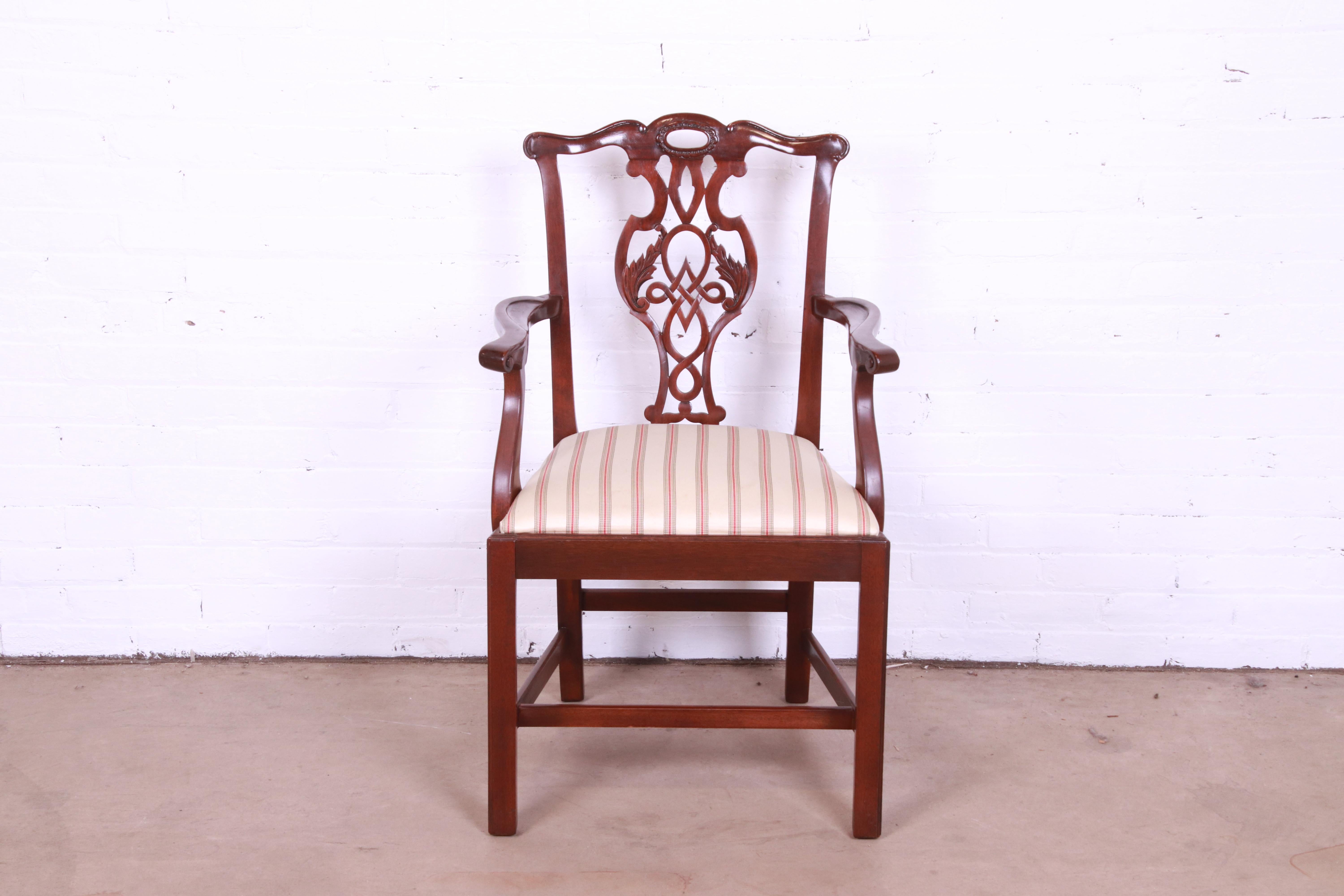 A gorgeous Chippendale style carved mahogany dining arm chair

By Baker Furniture, 