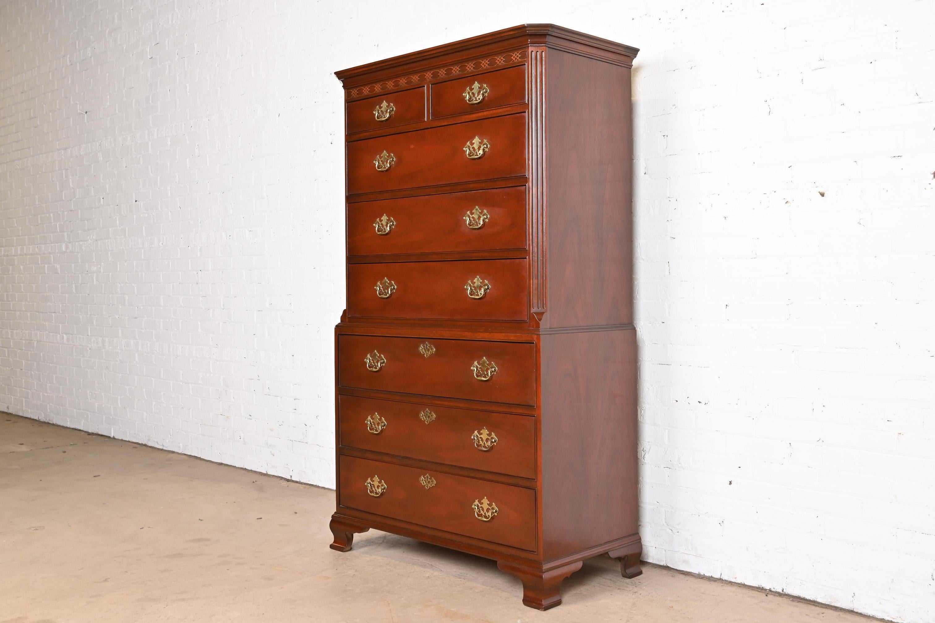 A gorgeous Chippendale or Georgian style eight-drawer highboy dresser or chest of drawers

By Baker Furniture

USA, Circa 1980s

Carved mahogany, with original brass hardware.

Measures: 39.5
