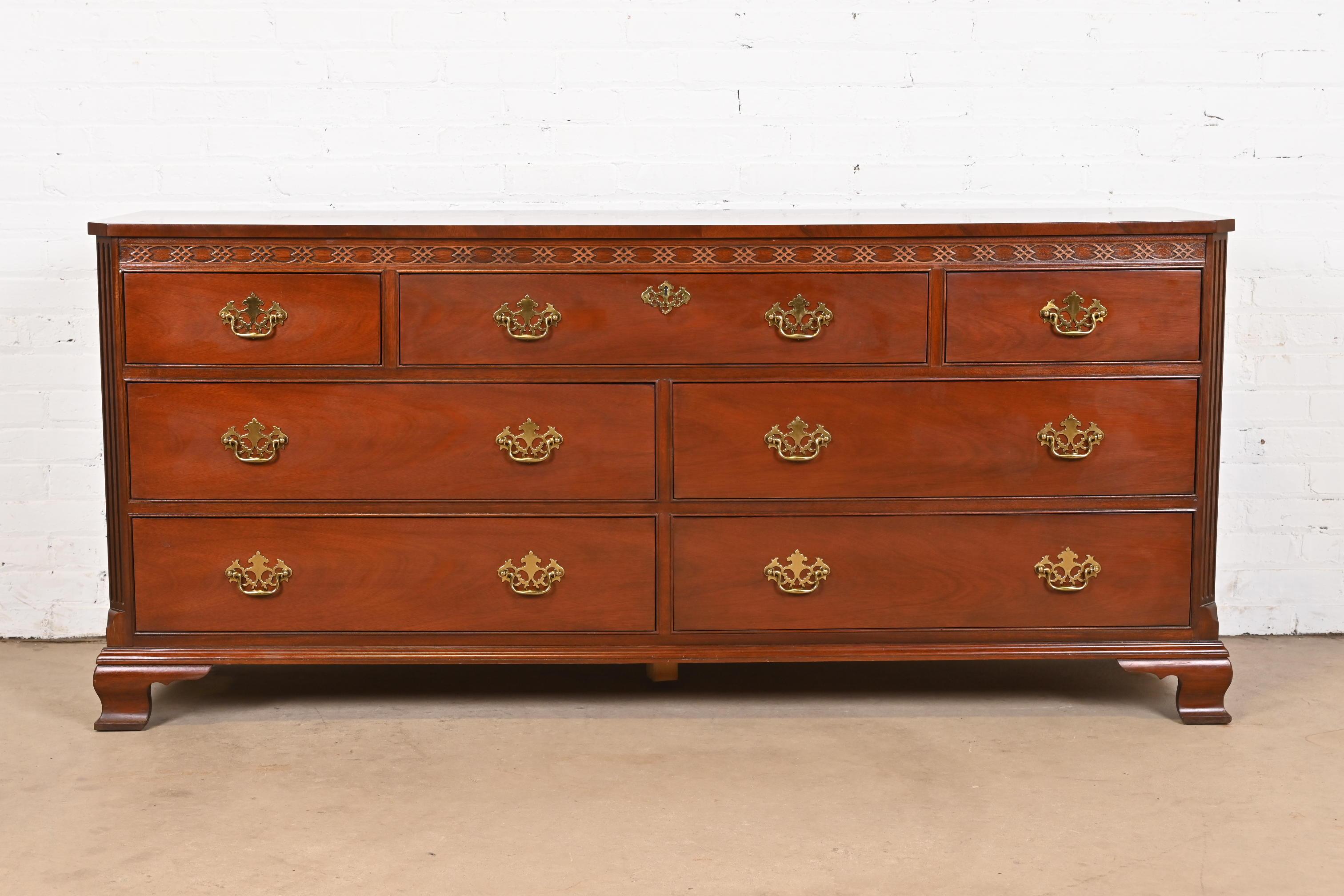 An exceptional Georgian or Chippendale style long dresser or credenza

By Baker Furniture

USA, Circa 1980s

Carved mahogany, with original brass hardware.

Measures: 72