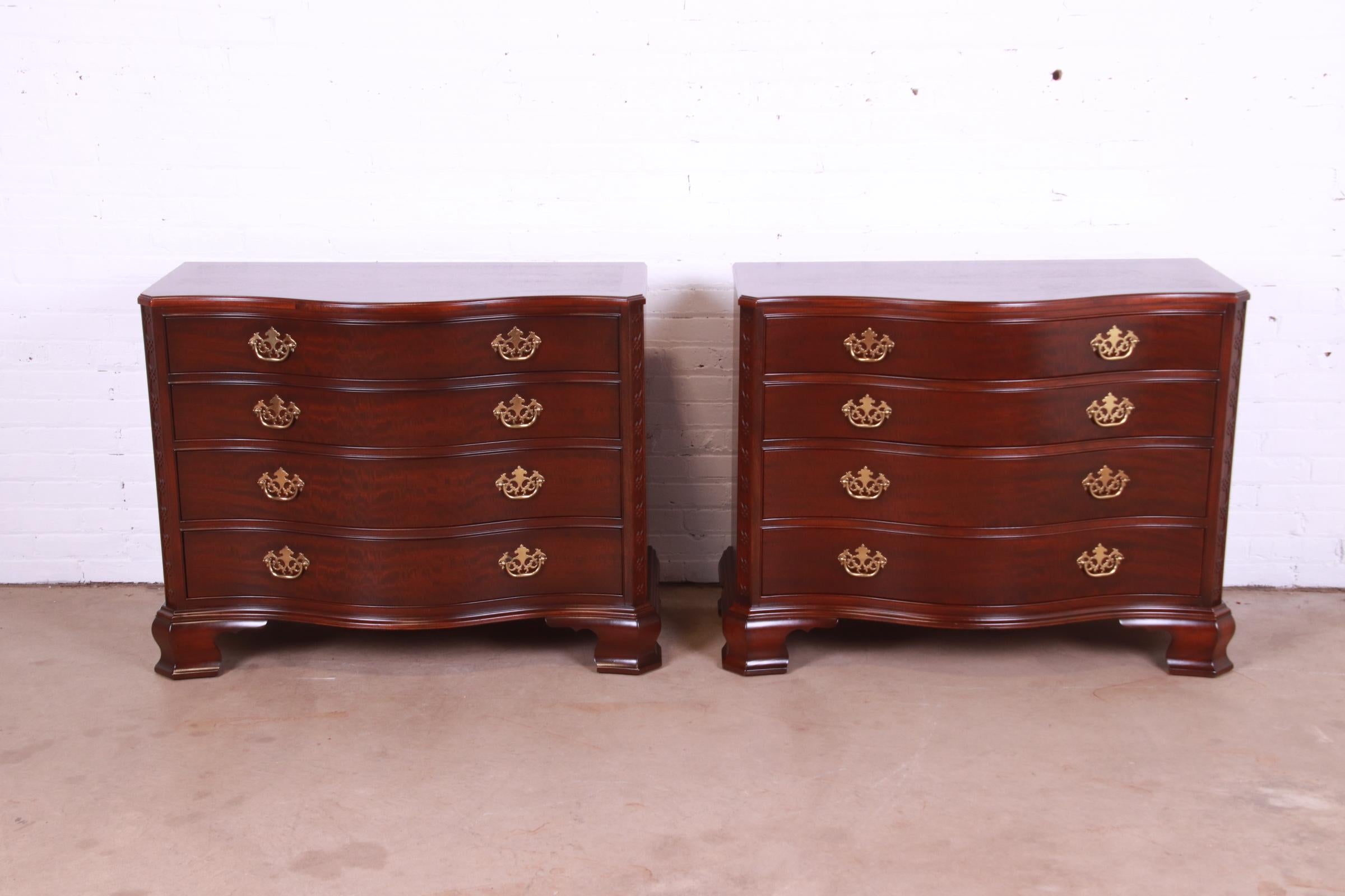 An exceptional pair of Georgian or Chippendale style serpentine front dressers or chests of drawers

By Baker Furniture, 