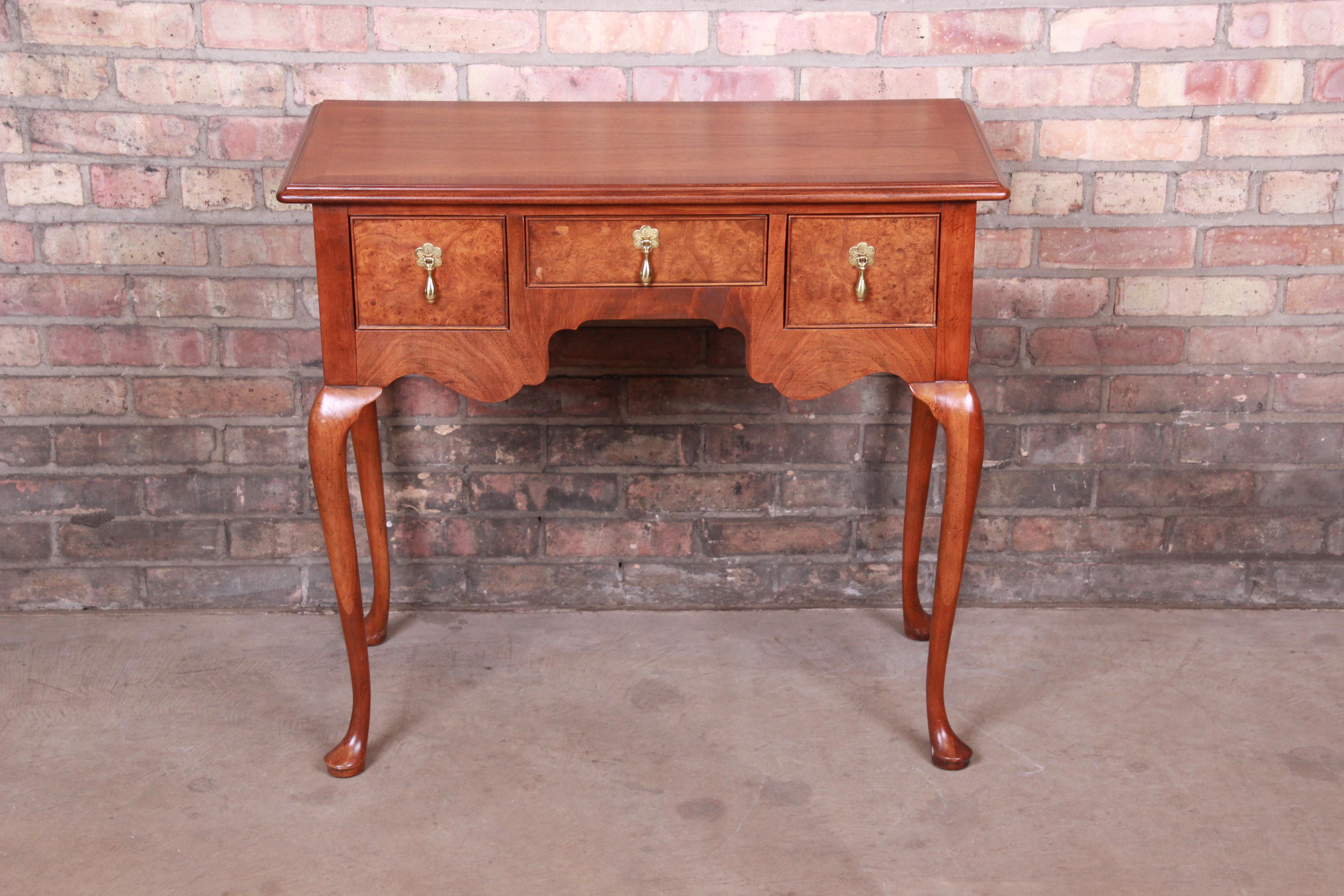 An exceptional Chippendale or Queen Anne style sideboard server, console, or entry table

By Baker Furniture

USA, circa 1970s

Book-matched mahogany, with burled walnut drawer fronts and original brass teardrop drawer pulls.

Measures: