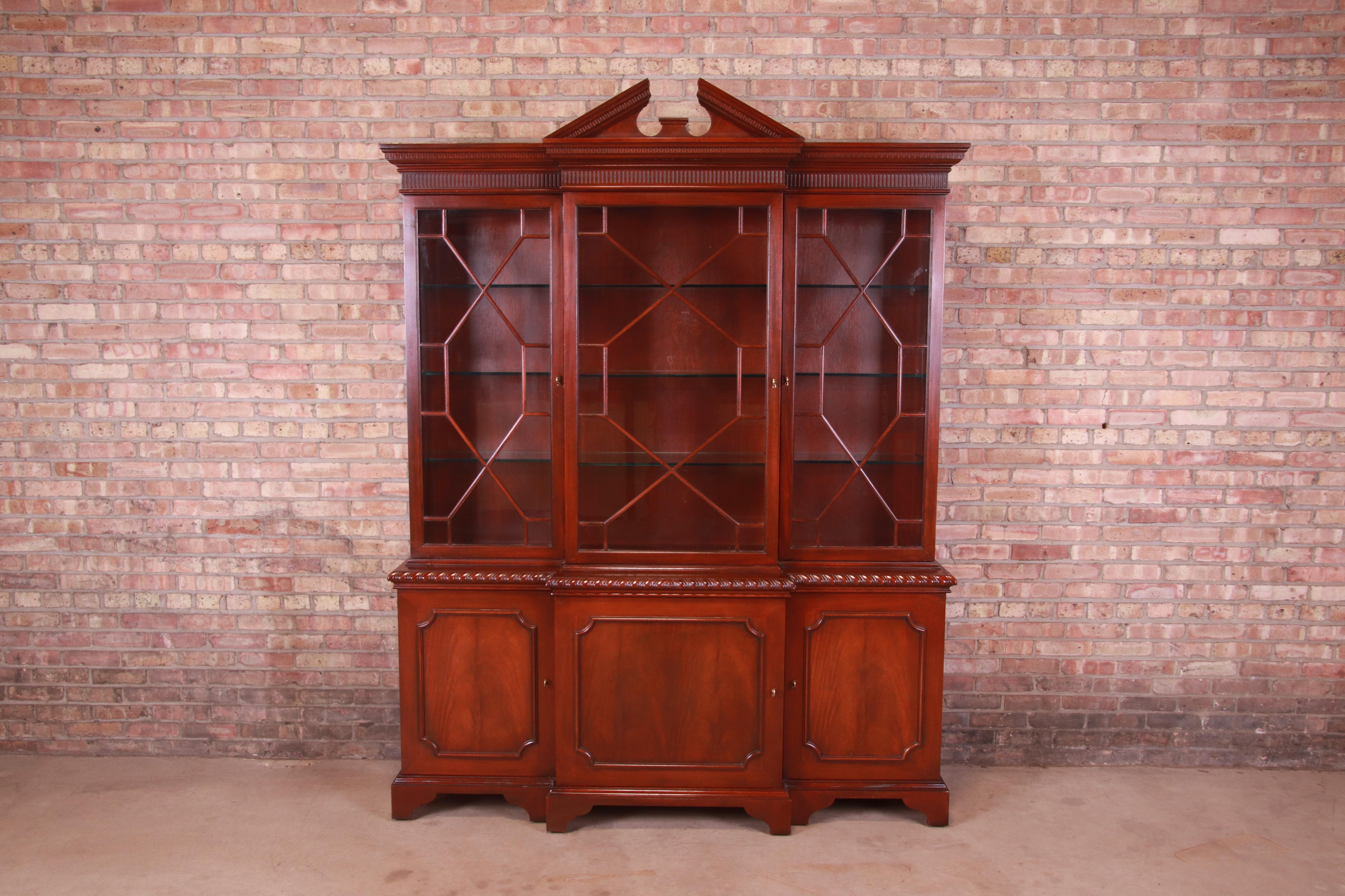 A gorgeous Chippendale or Georgian style lighted breakfront bookcase cabinet or dining cabinet

By Baker Furniture, 