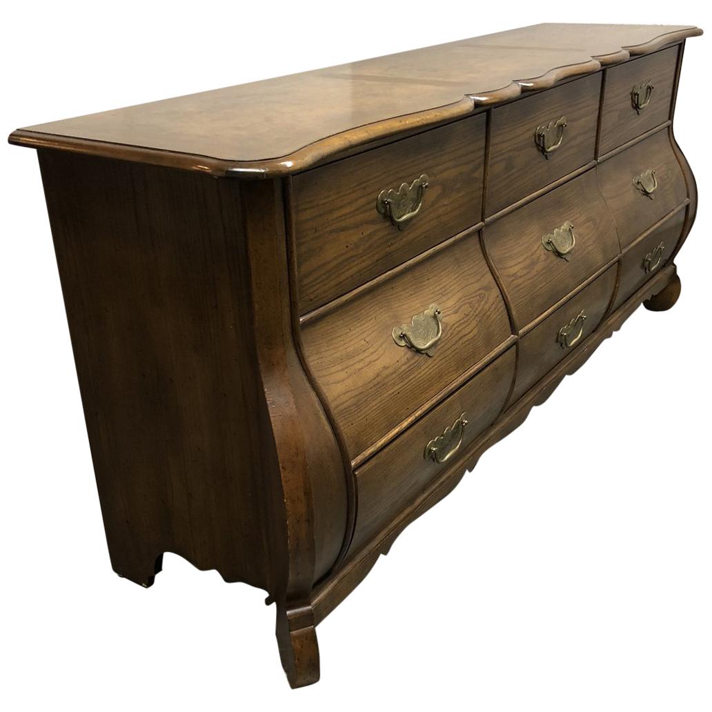 Baker Furniture "Collections Edition" Walnut Bombe Nine-Drawer Bureau For Sale