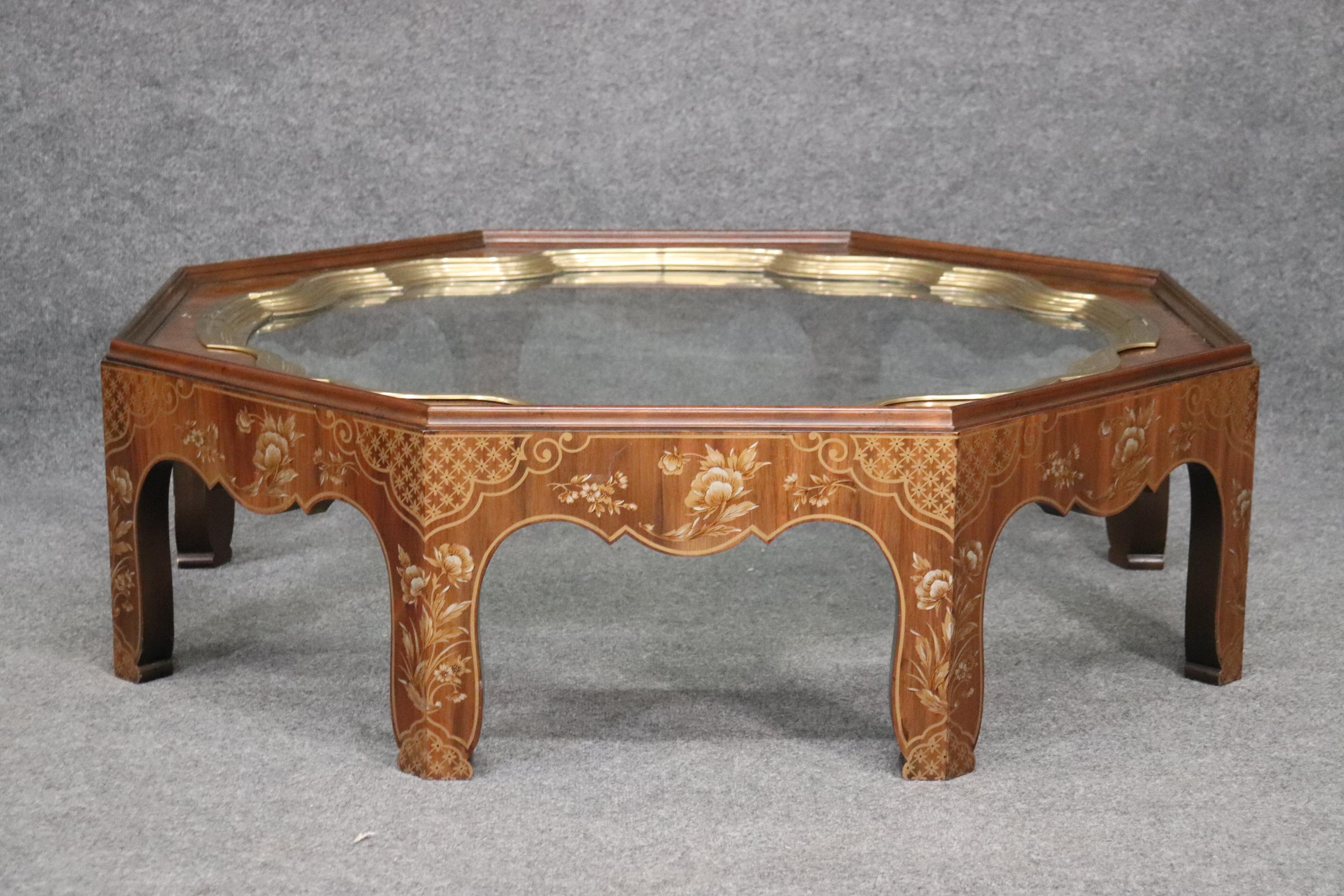 This is a classic Baker collector's edition tray top coffee gtable designed in the Chinese chinoiserie taste. The table is in good original condition with minor signs of age and wear from use. The table measures 49 wide x 49 deep x 15 inches tall.
