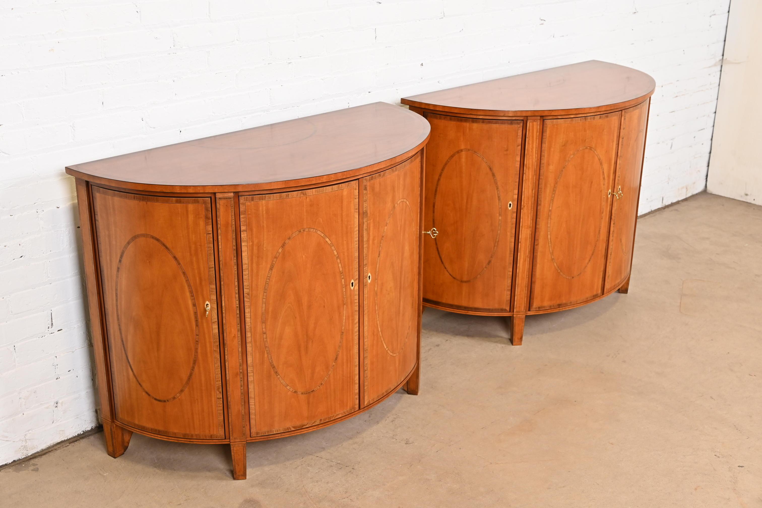 Late 20th Century Baker Furniture Colonial Williamsburg Federal Inlaid Fruitwood Demilune Cabinets
