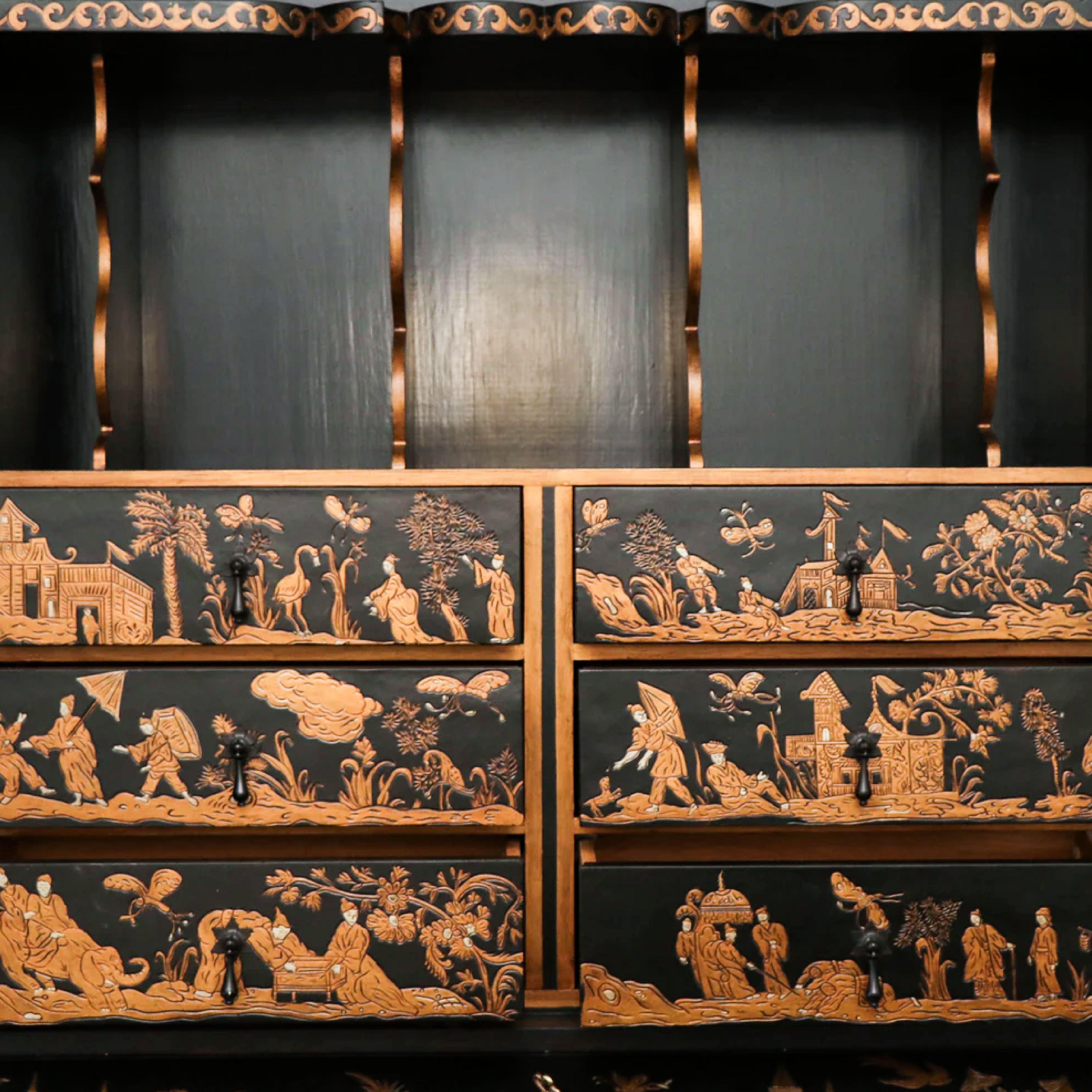Baker Furniture Company black Japanned chinoiserie Venetian secretary desk, gilt accents. Baker black Venetian secretary desk from Baker’s ‘Collector’s Edition’. Scalloped and bevelled crest above two doors that open to reveal shelves and six