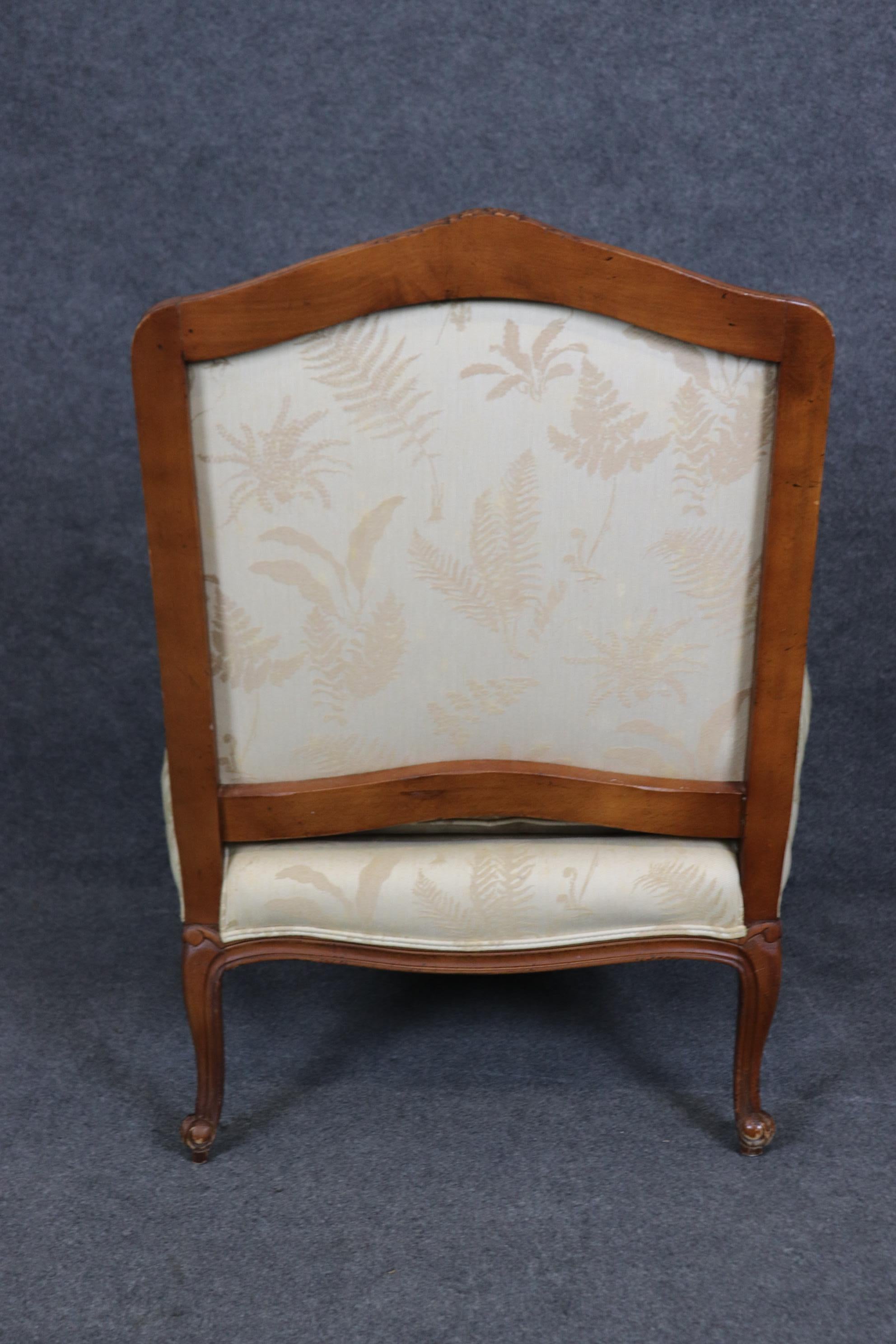 Baker Furniture Company Carved Walnut French Louis XV Style Arm Chair  & Ottoman For Sale 2