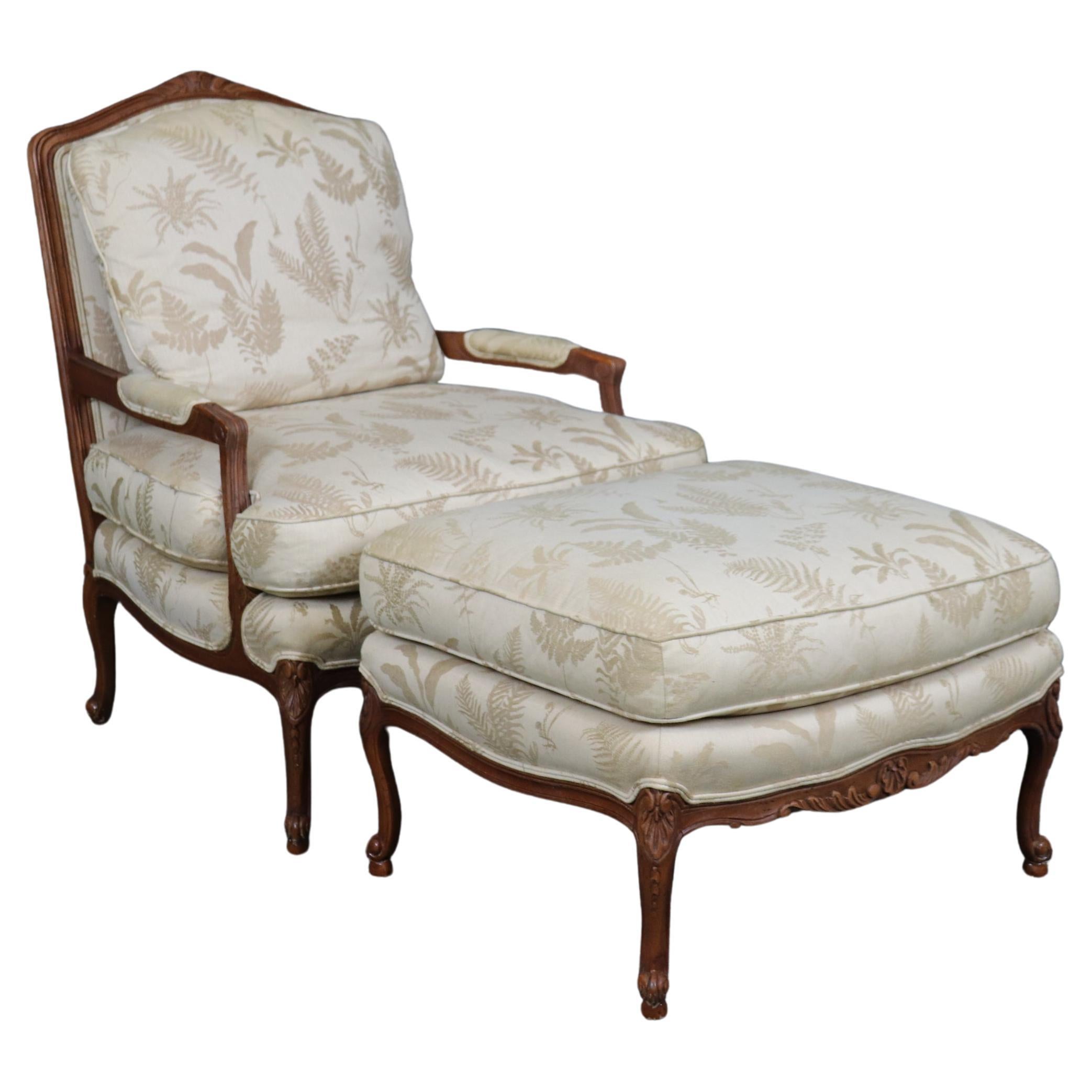 Baker Furniture Company Carved Walnut French Louis XV Style Arm Chair  & Ottoman For Sale