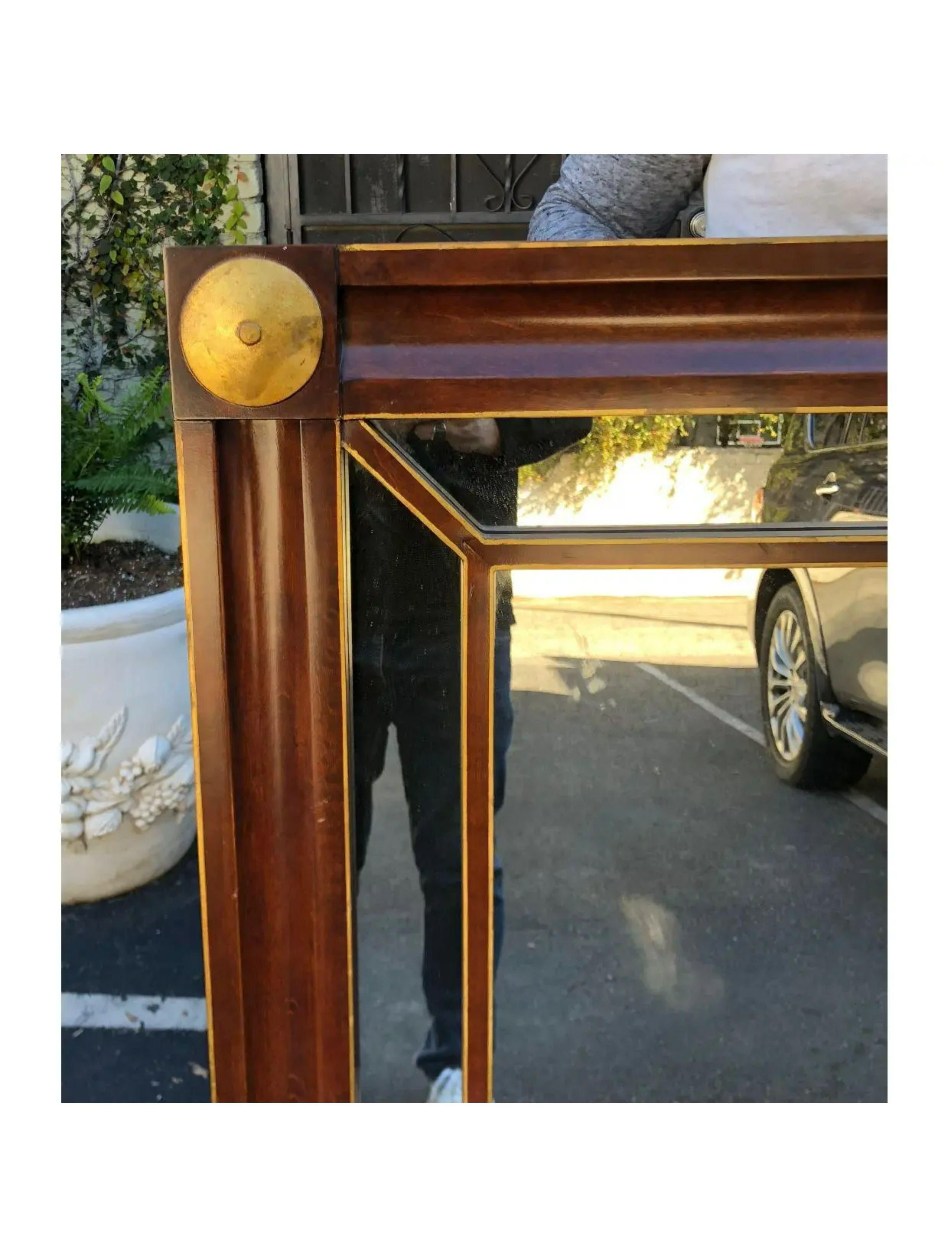 Empire mahogany & gilt-wood mirror by Baker Furniture Company

Additional information: 
Materials: mahogany, mirror
Please note that this item contains materials that are legally subject to a special export process that may extend the delivery