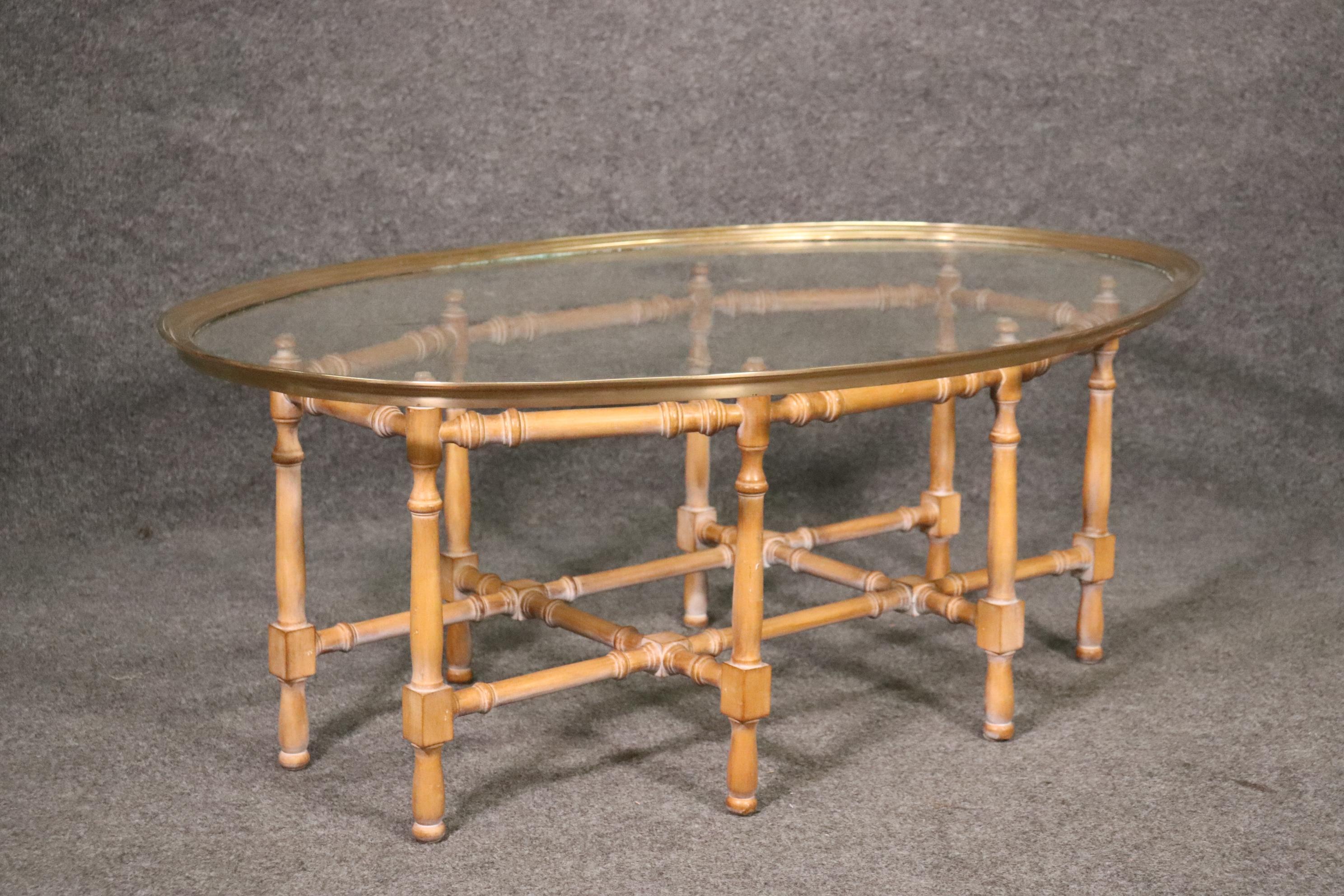 This is an unlabled but most certainly Baker tray top Faux Bamboo cocktail coffee table. The coffee table is an absolute classic and in good condition. Measures 44 wide x 17 tall x 31 deep.