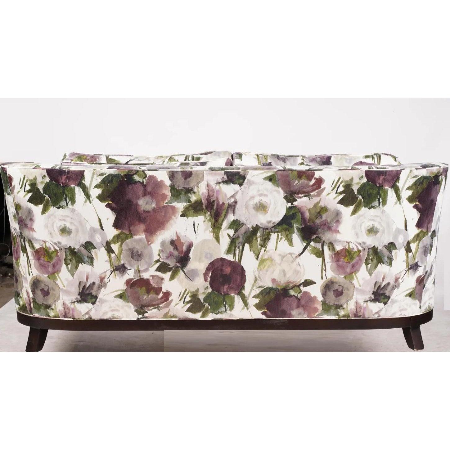Baker Furniture Company upholstered sofa w purple floral Modern Art Deco style print.

Marked Baker Furniture Company under the center cushion.