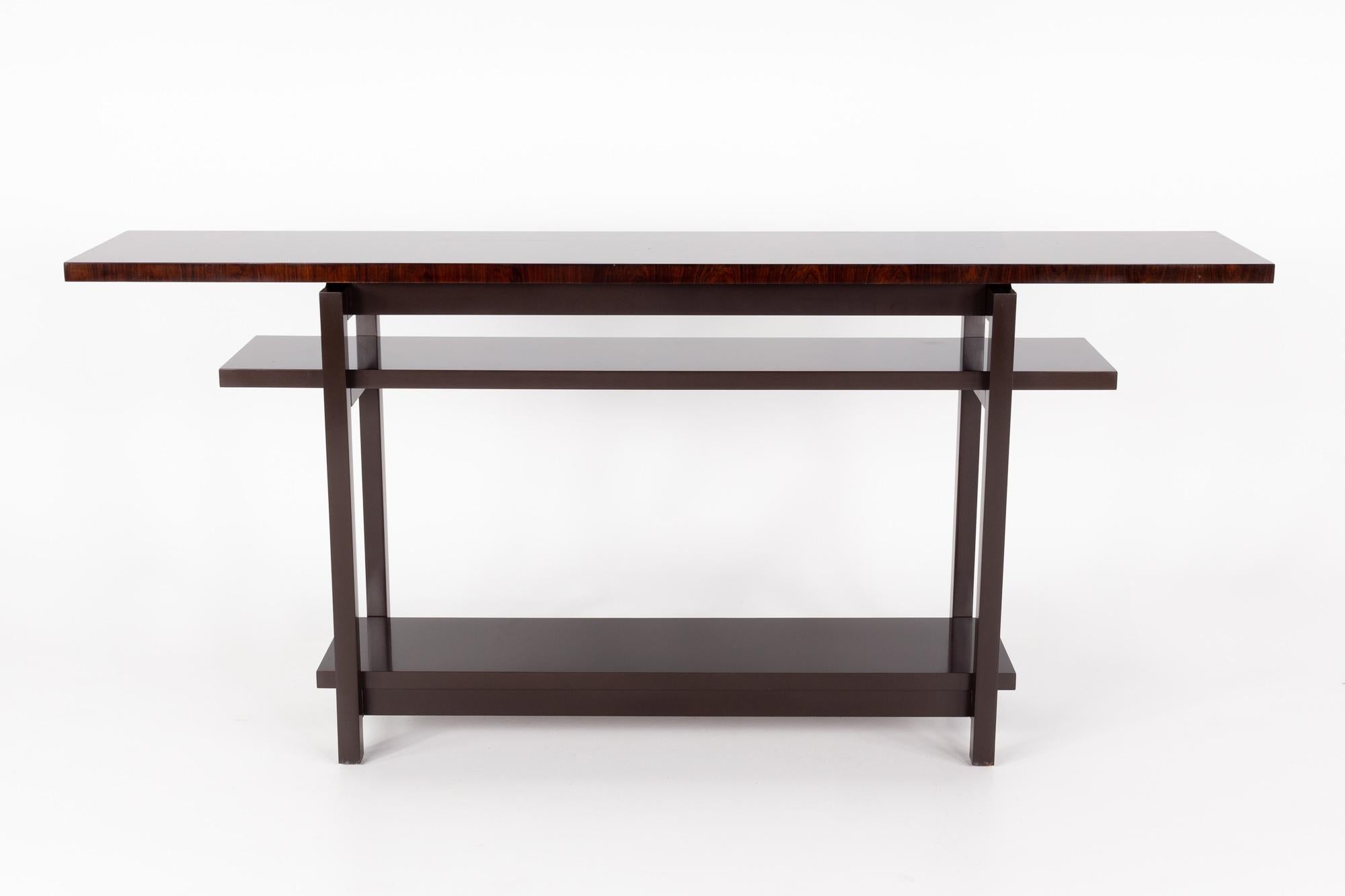 Baker Furniture contemporary console table

This table measures: 76.5 wide x 14.5 deep x 34.5 high

This piece has some light scratches, but is in Great Vintage Condition.

About Photos: We take our photos in a controlled lighting studio to show as