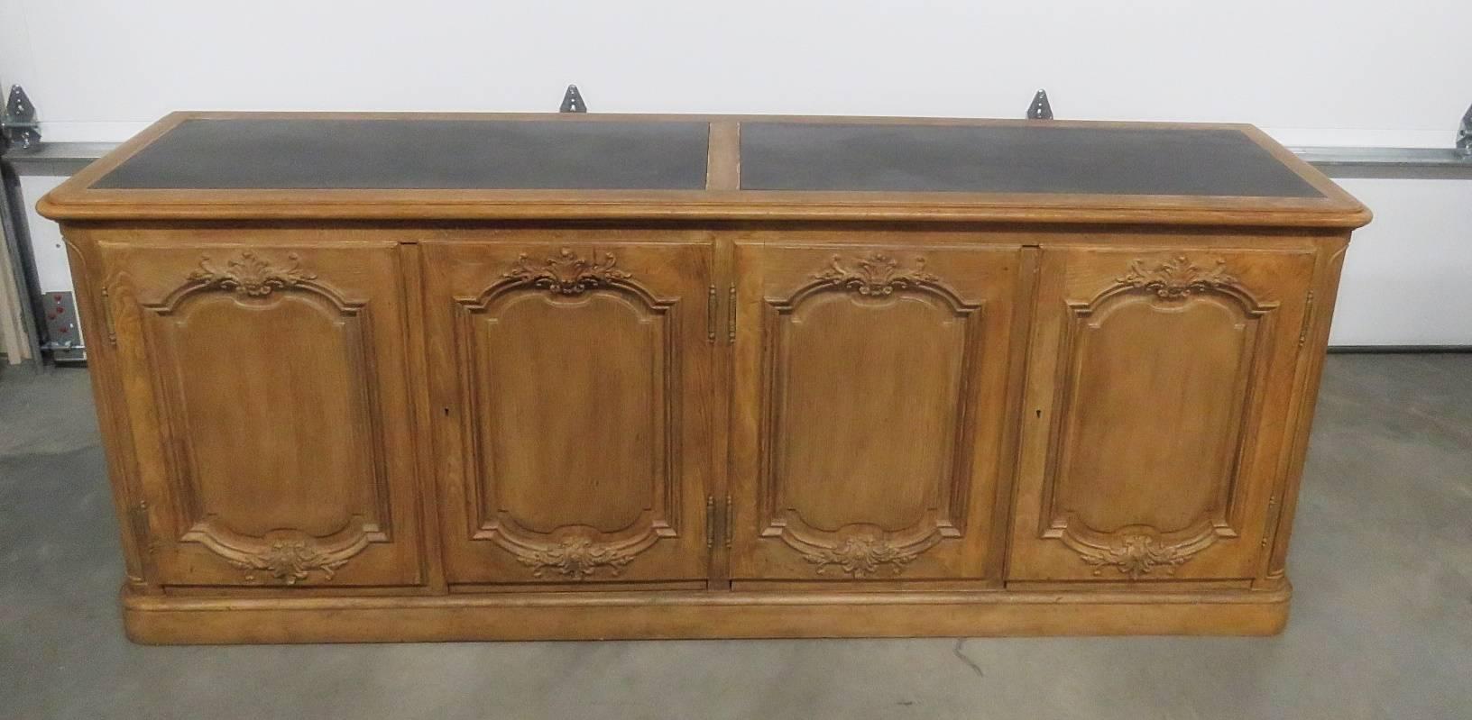 Baker Furniture Country French style slate top sideboard with four doors, two drawers and one shelf.