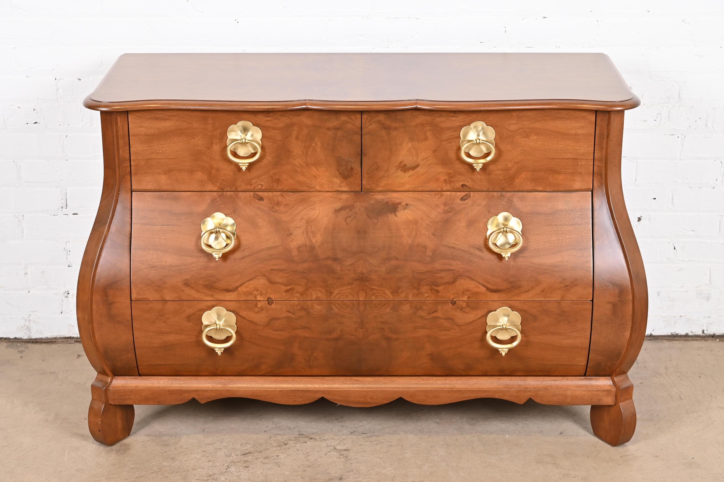 A gorgeous Dutch or French Provincial Louis XV style bombay chest, dresser, or commode

By Baker Furniture

USA, Circa 1960s

Stunning book-matched burled walnut, with original brass hardware.

Measures: 47