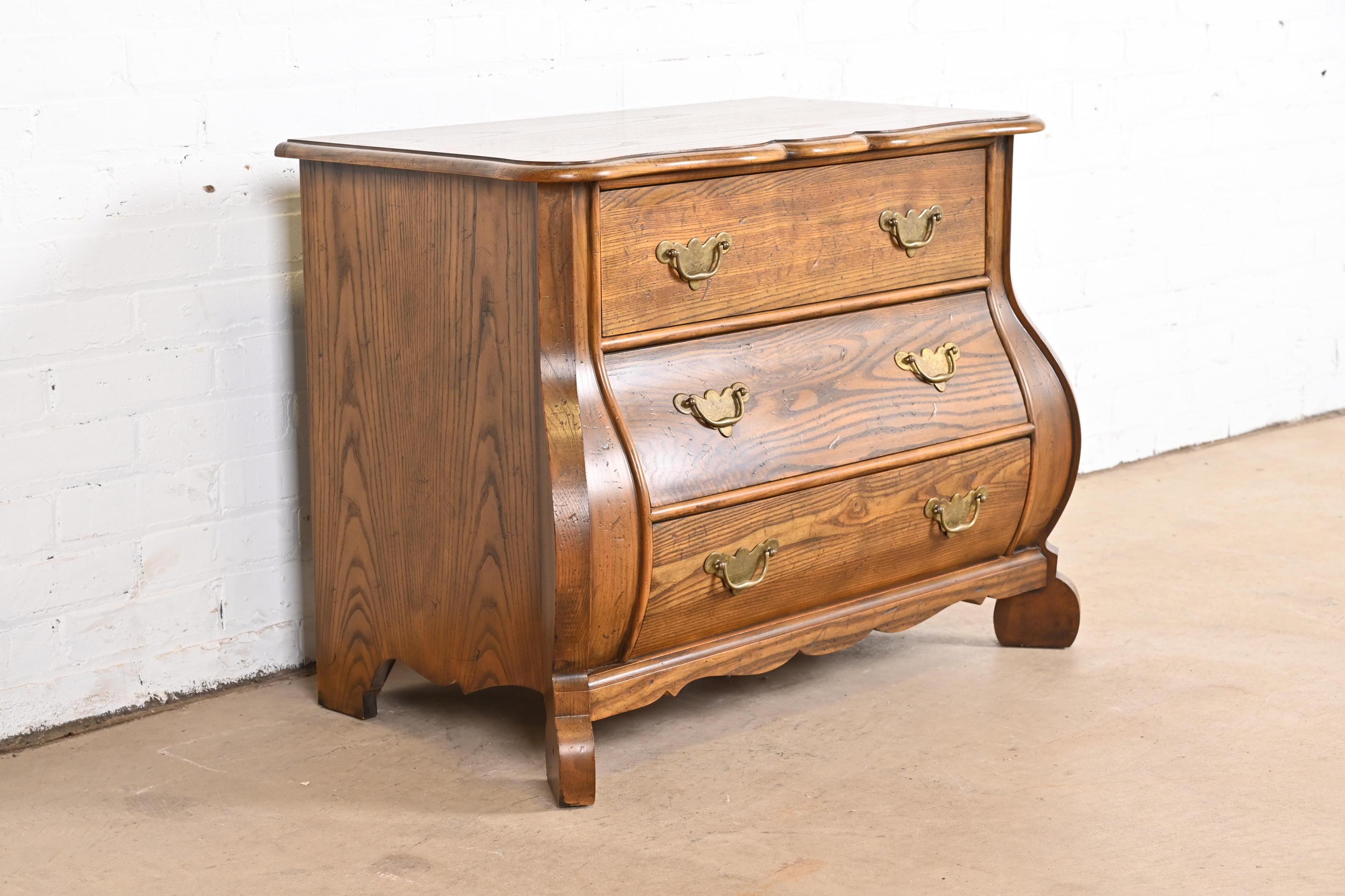Mid-20th Century Baker Furniture Dutch Oak Bombe Chest or Commode