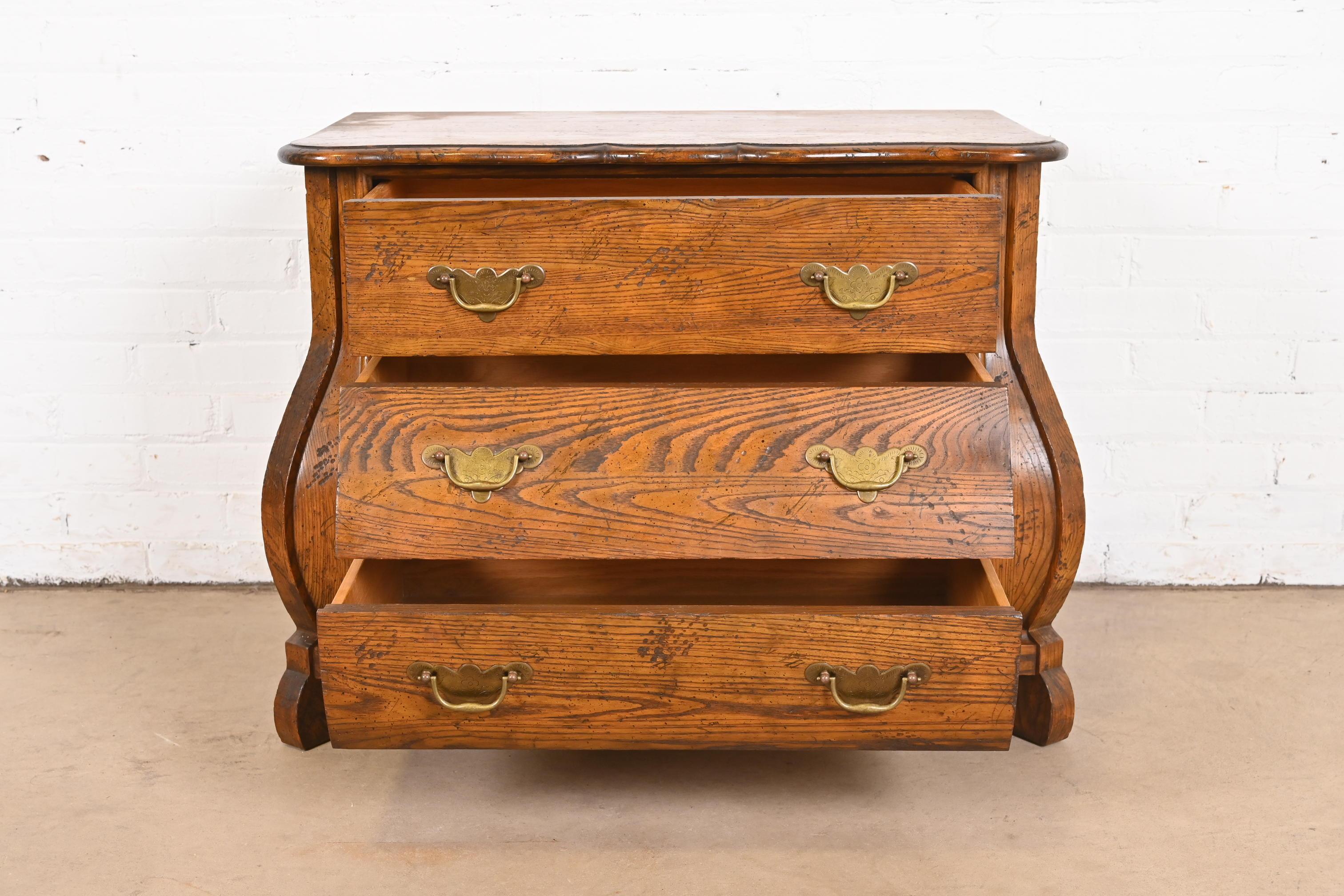 Mid-20th Century Baker Furniture Dutch Oak Bombe Chest or Commode For Sale