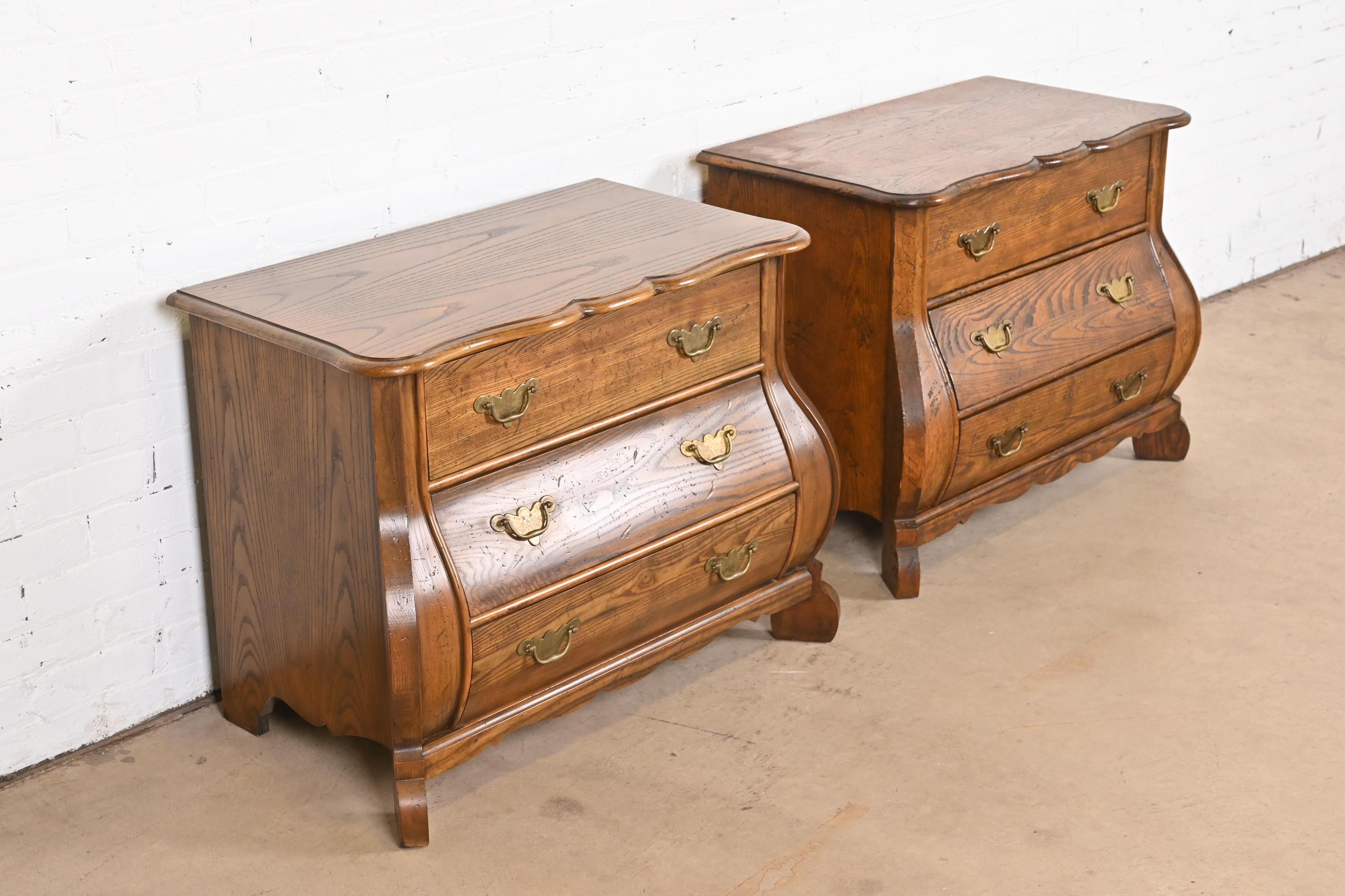 Mid-20th Century Baker Furniture Dutch Oak Bombe Chests or Commodes, Pair