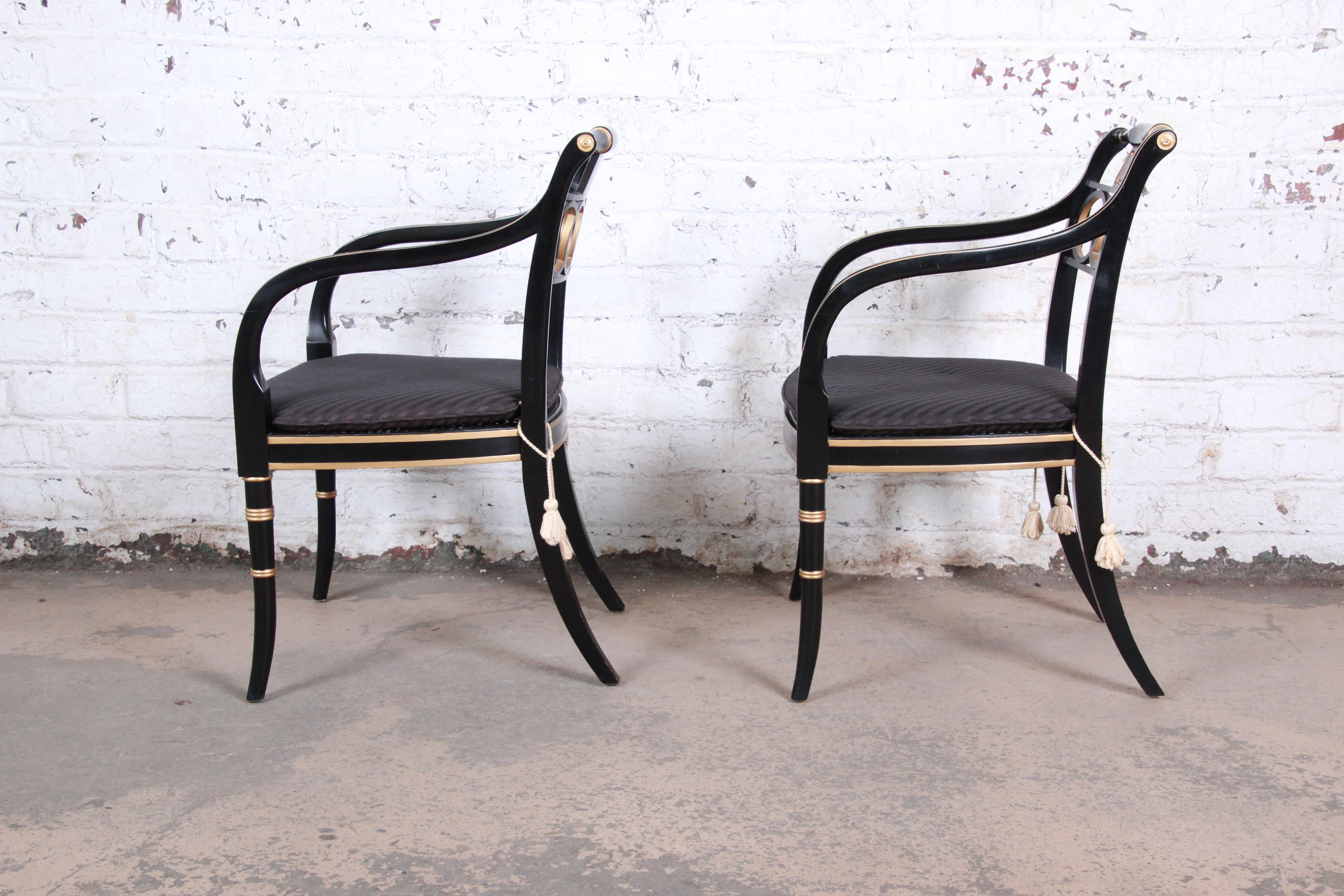 Cane Baker Furniture Ebonized and Gold Gilt Regency Style Armchairs, Set of Four