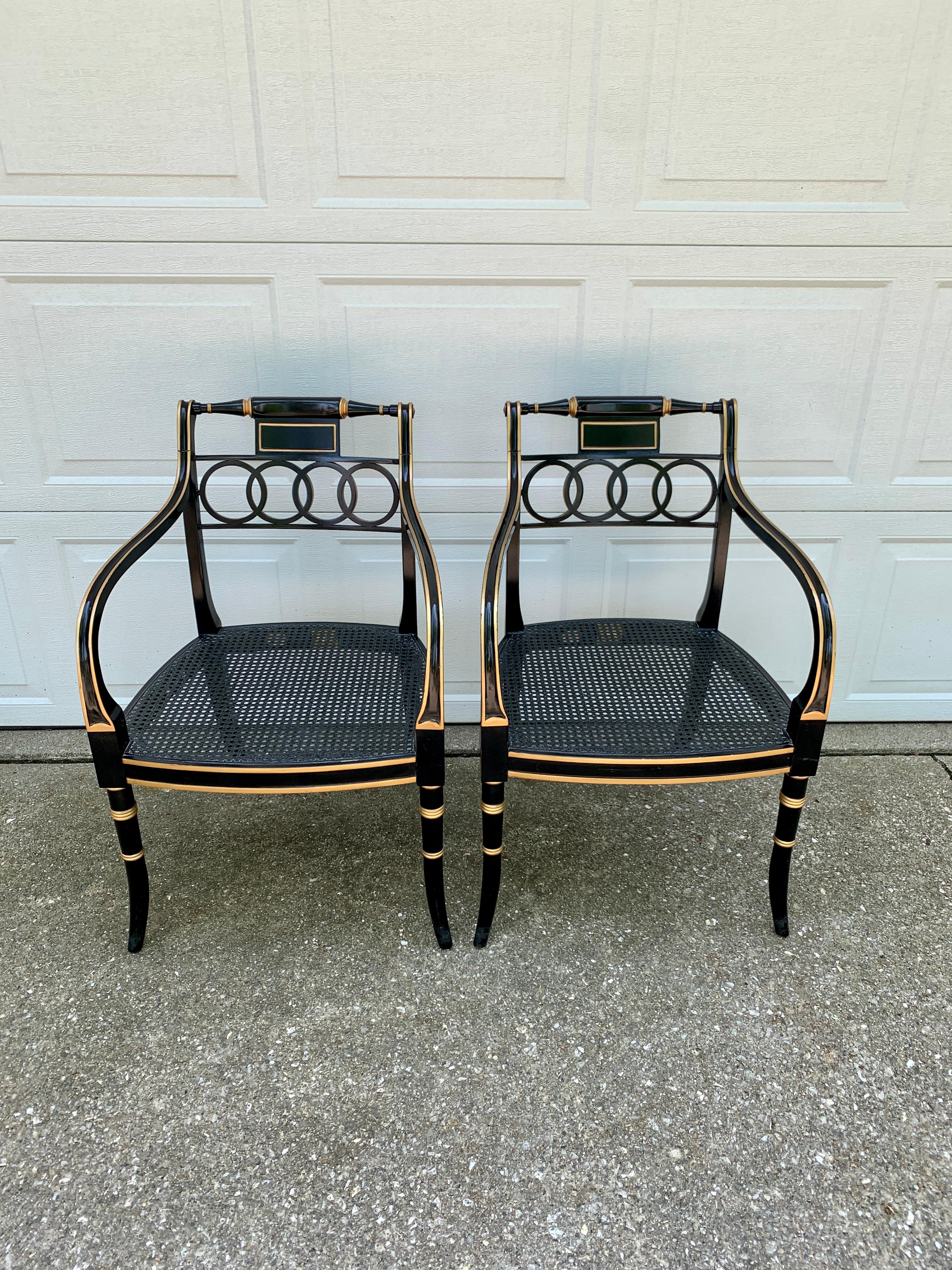 A gorgeous pair of Regency style armchairs or club chairs

By Baker Furniture, 