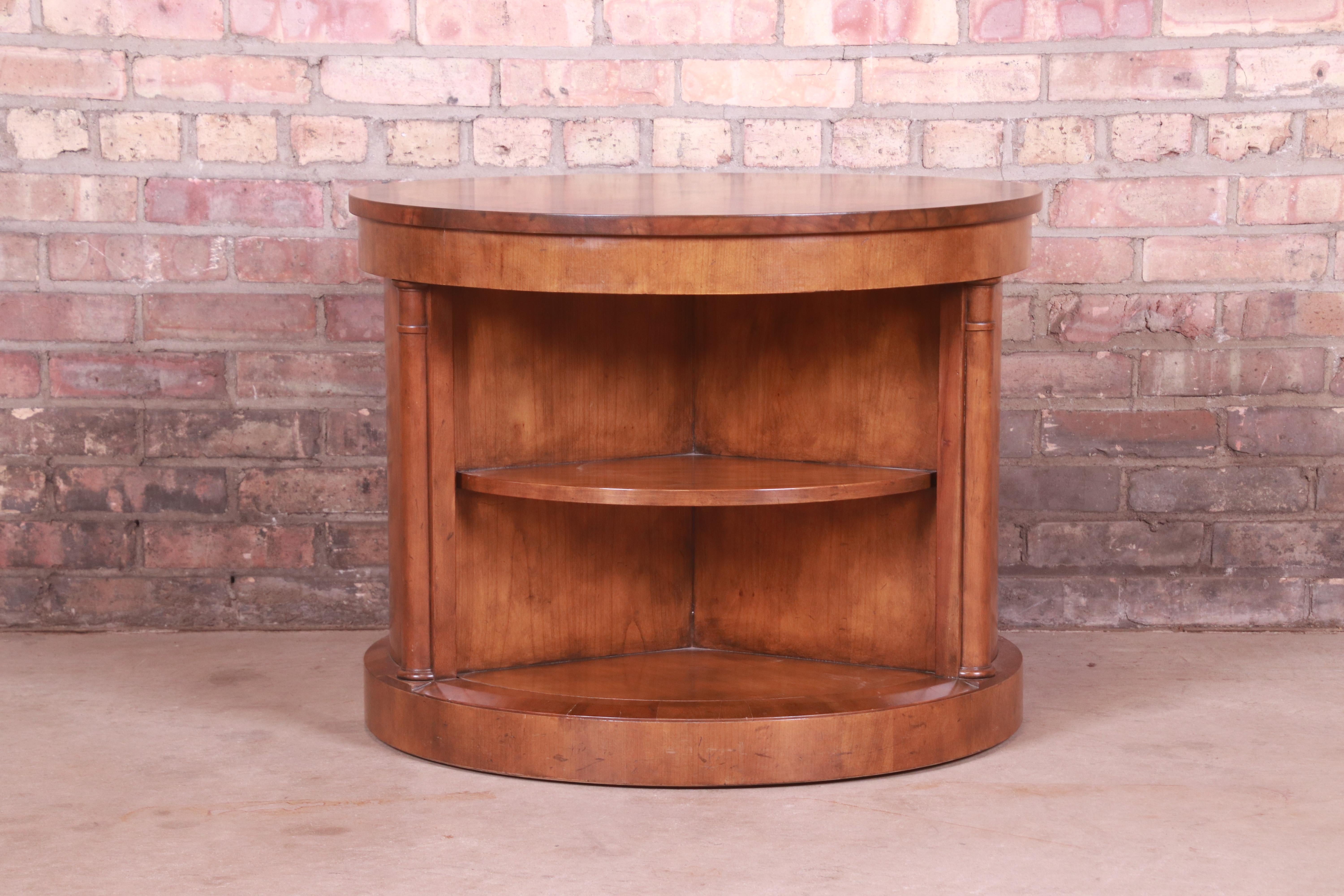 A gorgeous Empire or Neoclassical style drum side table or tea table with unique rotating Lazy Susan interior

By Baker Furniture

USA, Circa 1980s

Walnut, with burled walnut top with inlaid starburst design.

Measures: 28