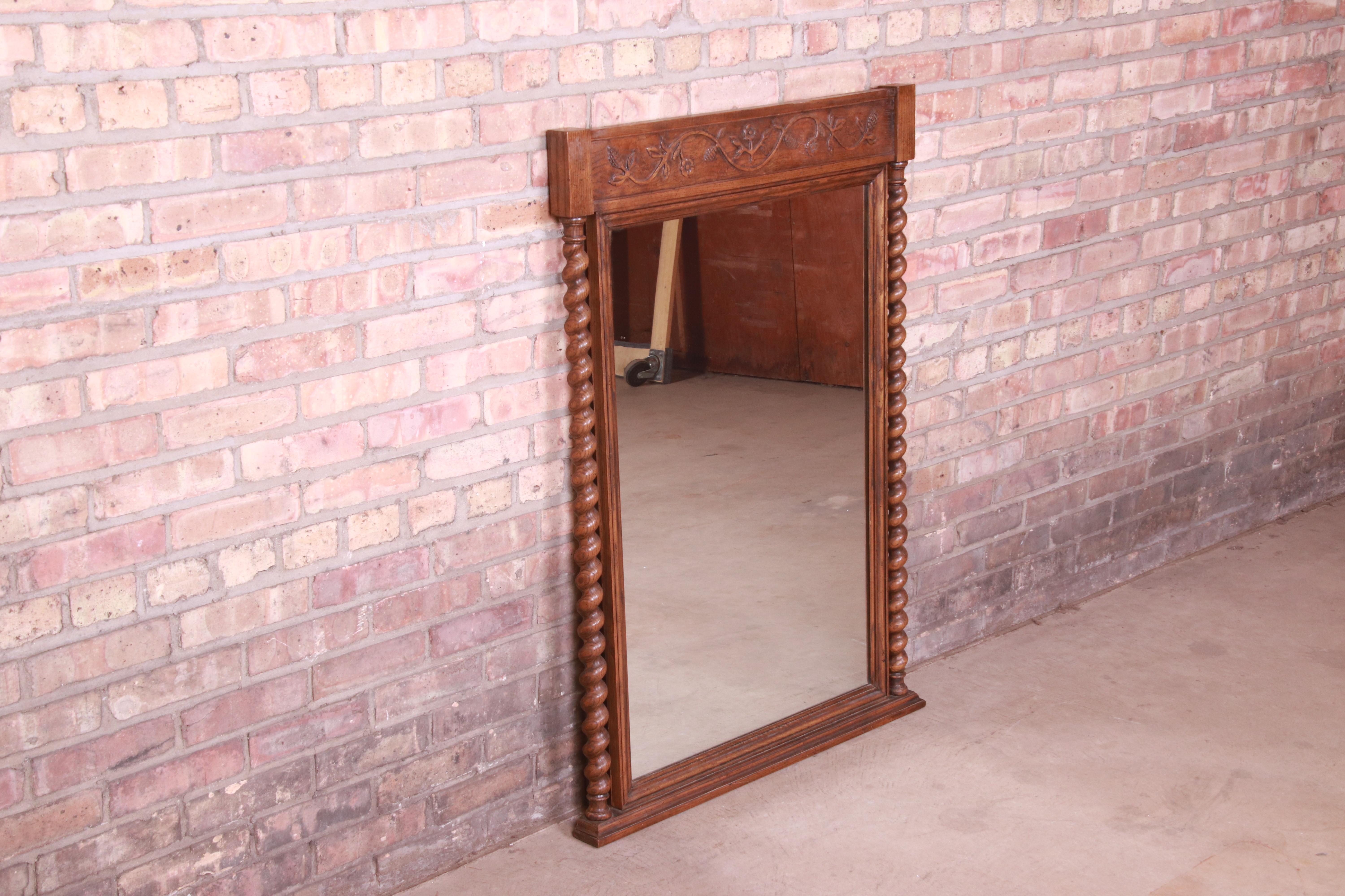 20th Century Baker Furniture English Barley Twist Carved Oak Framed Wall Mirror, Circa 1960s For Sale