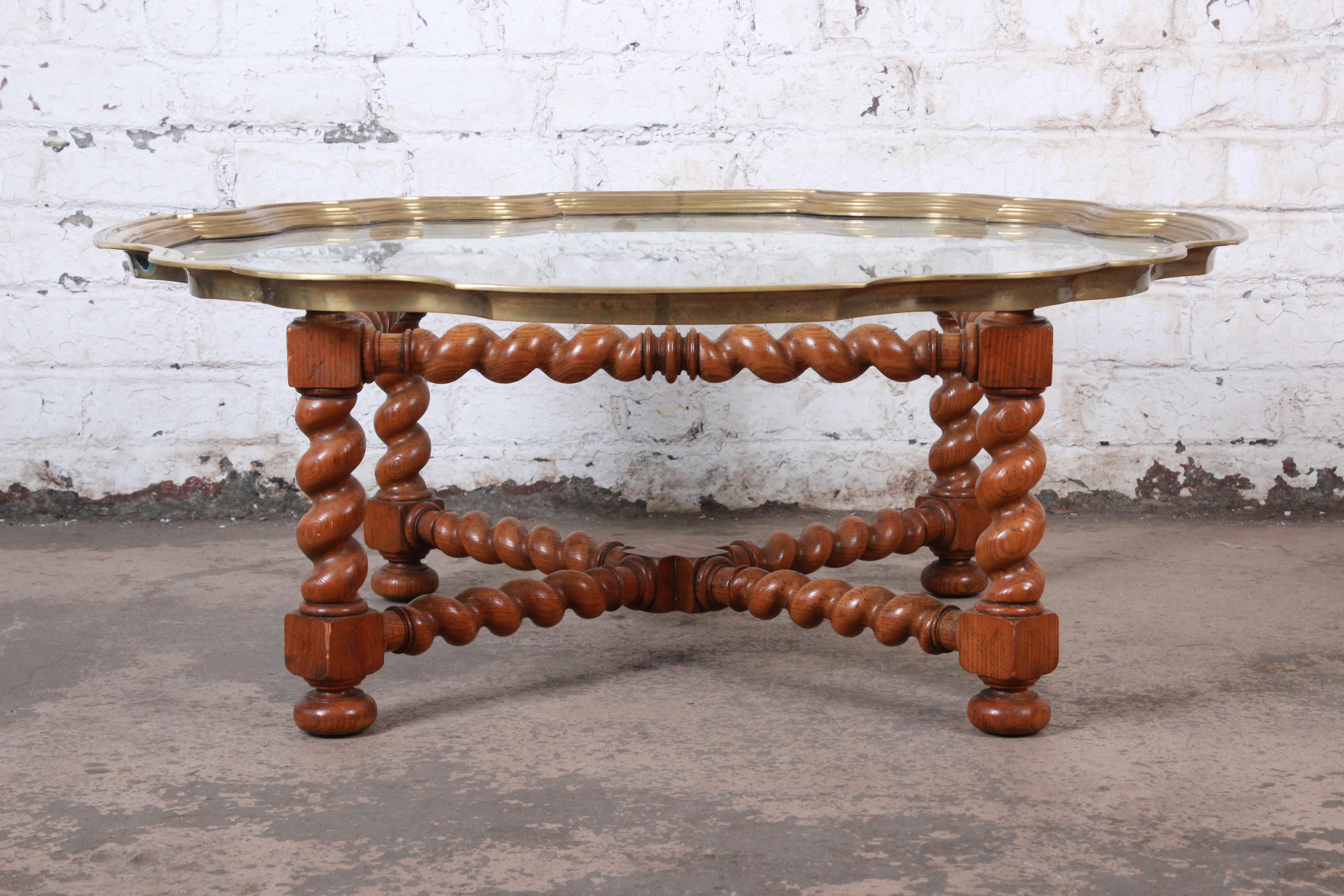 A gorgeous English barley twist coffee or cocktail table

By Baker Furniture

USA, circa 1960s

Oak, brass and glass

Measures: 43.5