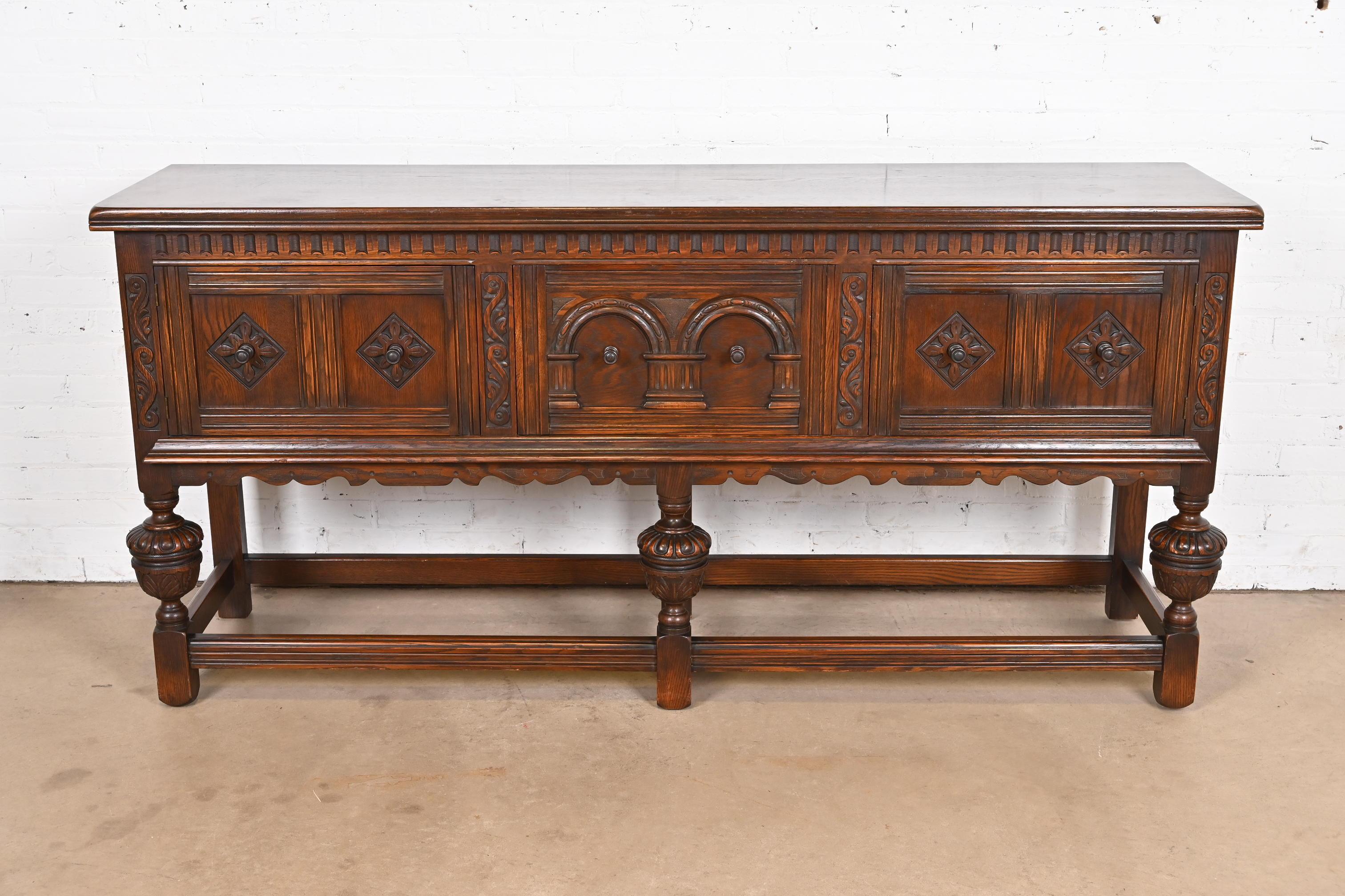 Baker Furniture English Jacobean Ornate Carved Oak Sideboard or Credenza In Good Condition In South Bend, IN