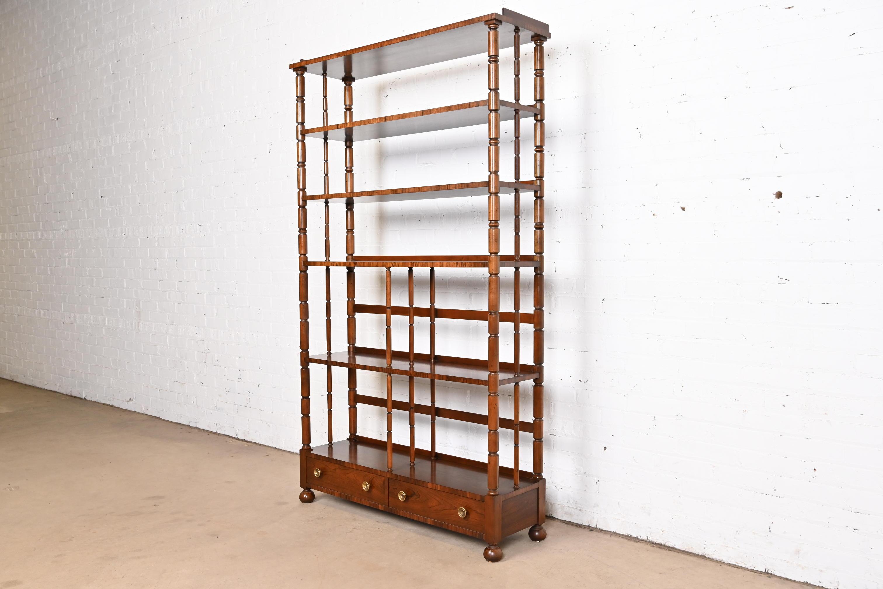 An exceptional English Regency style etagère, bookcase, wall unit, or room divider

By Baker Furniture

USA, Circa 1960s

Gorgeous carved rosewood, with original brass hardware.

Measures: 42.25