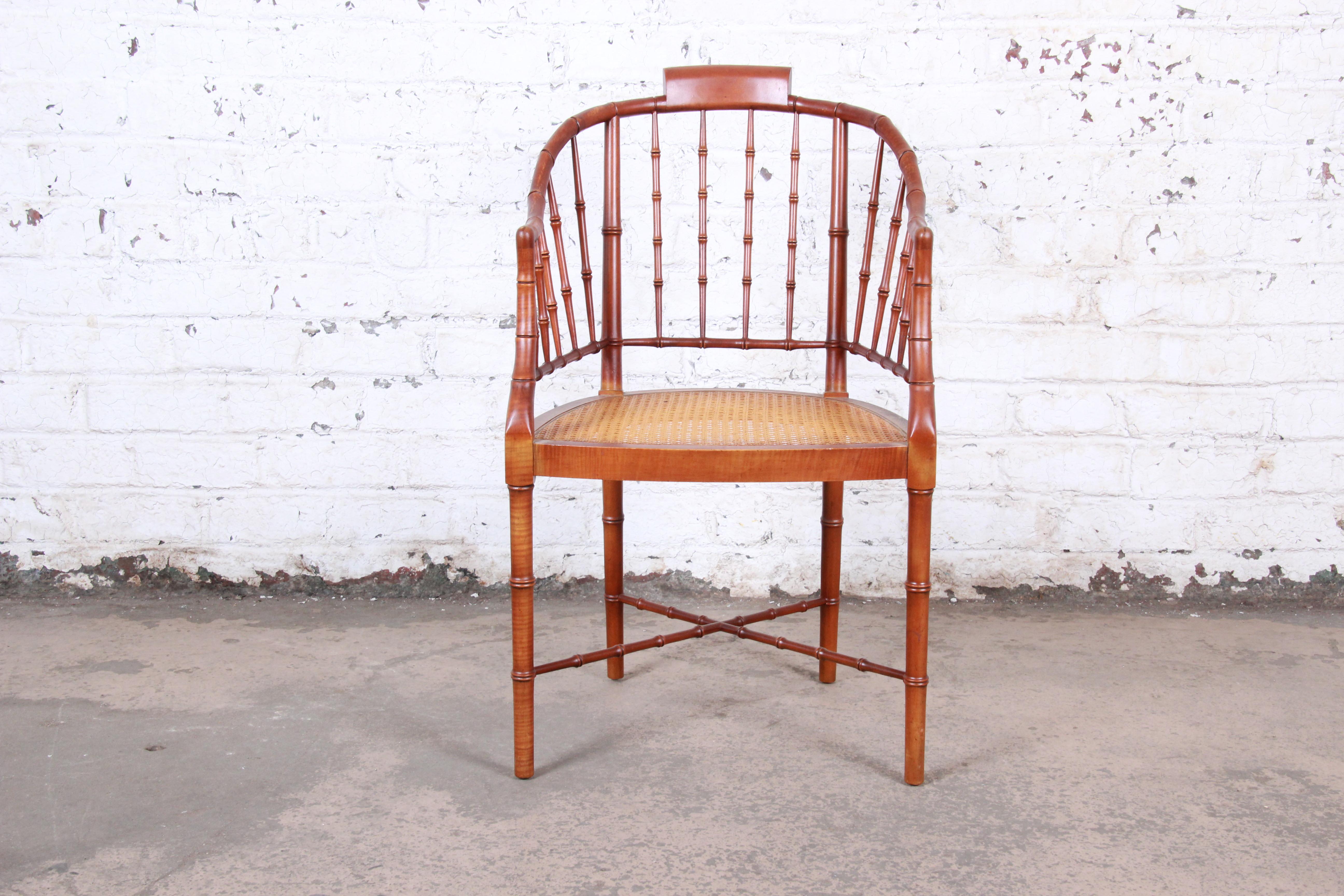 A gorgeous faux bamboo Regency armchair

By Baker Furniture

USA, 1960s

Faux bamboo and cane

Measures: 21